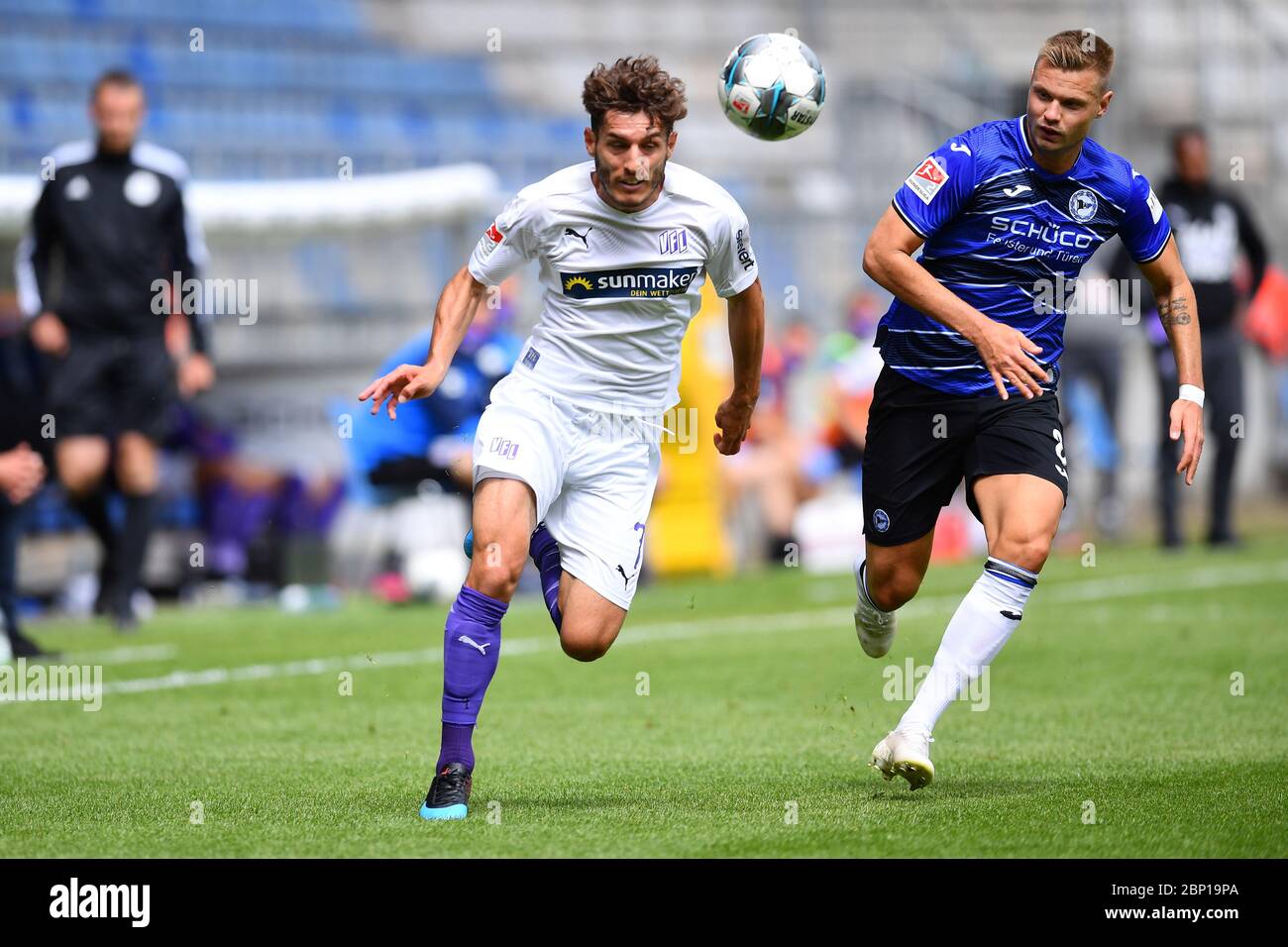 Westphalia, Germany. 17th May, 2020. FILED - 17 May 2020, North Rhine-Westphalia, Bielefeld: Football, 2nd Bundesliga, DSC Arminia Bielefeld - VfL Osnabrück, 26th matchday, Schüco-Arena: Bashkim Ajdini (l) from Osnabrück and Florian Hartherz from Bielefeld in action. After a 65-day Corona break, the ball is rolling again in the Bundesliga. The matches take place without spectators. Photo: Stuart Franklin/Getty/POOL/dpa - IMPORTANT NOTE: In accordance with the regulations of the DFL Deutsche Fußball Liga and the DFB Deutscher Fußball-Bund, it is prohibited to exploit or have exploited in the st Stock Photo