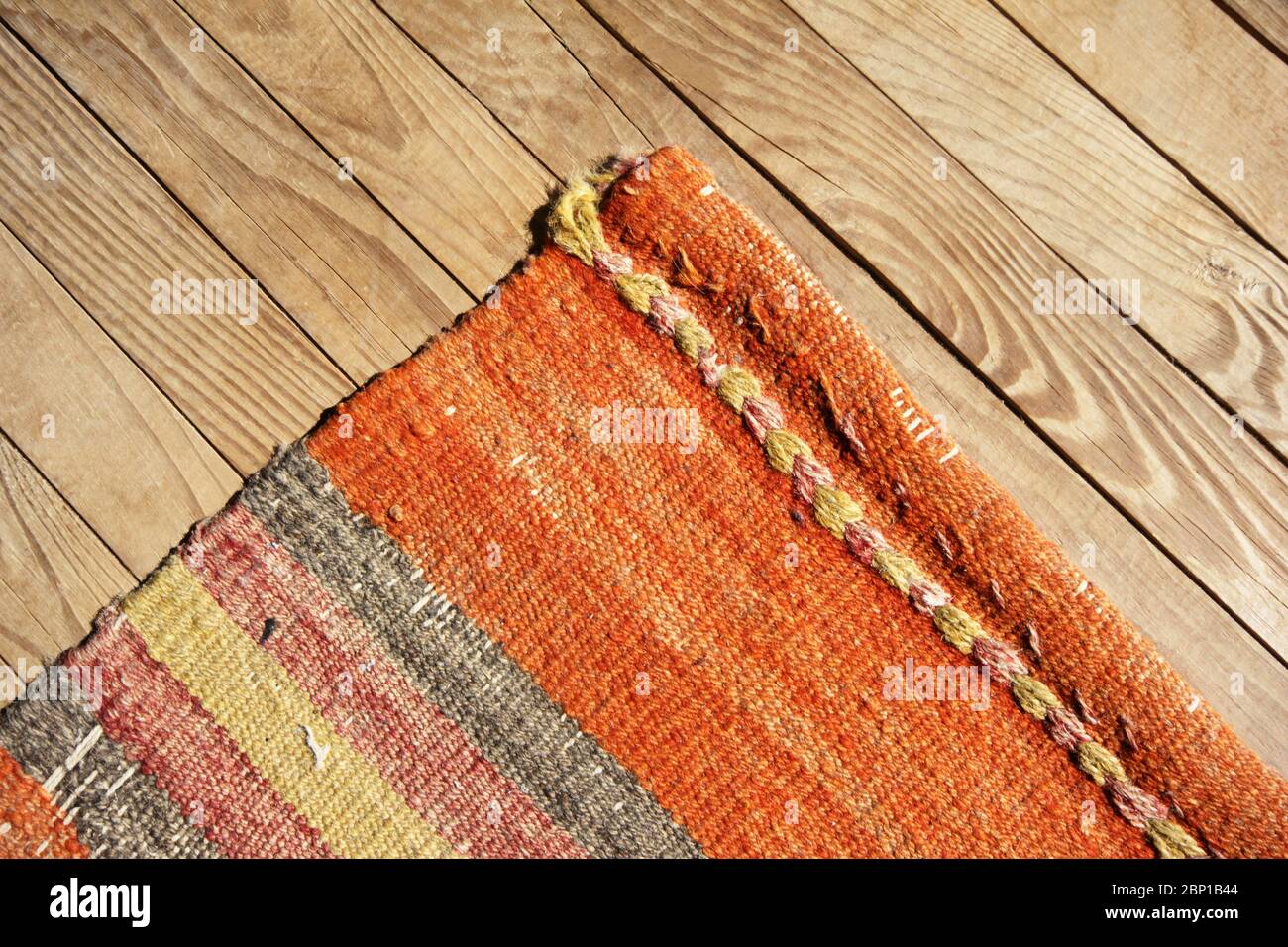 antique wool rugs on parquet Stock Photo Alamy