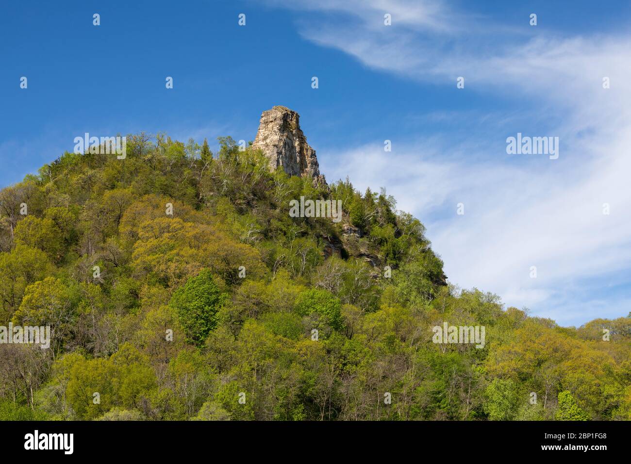 Sugar Loaf - A rock formation on top of a hill during spring. Stock Photo