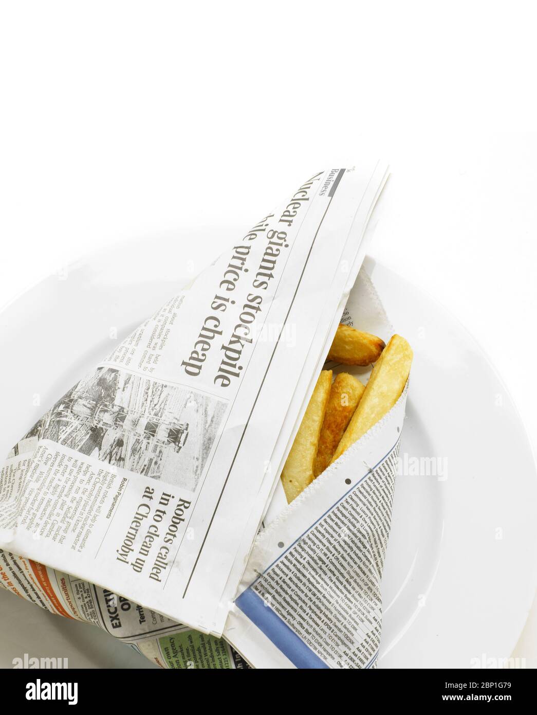 Chips wrapped in a newspaper Stock Photo Alamy