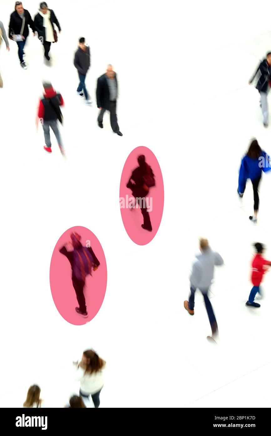Crowd of people walking. Transparent disk defines people covid positive Stock Photo