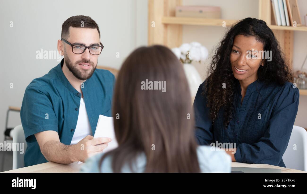 Close up african american businesswoman and businessman listening applicant introduction. Stock Photo
