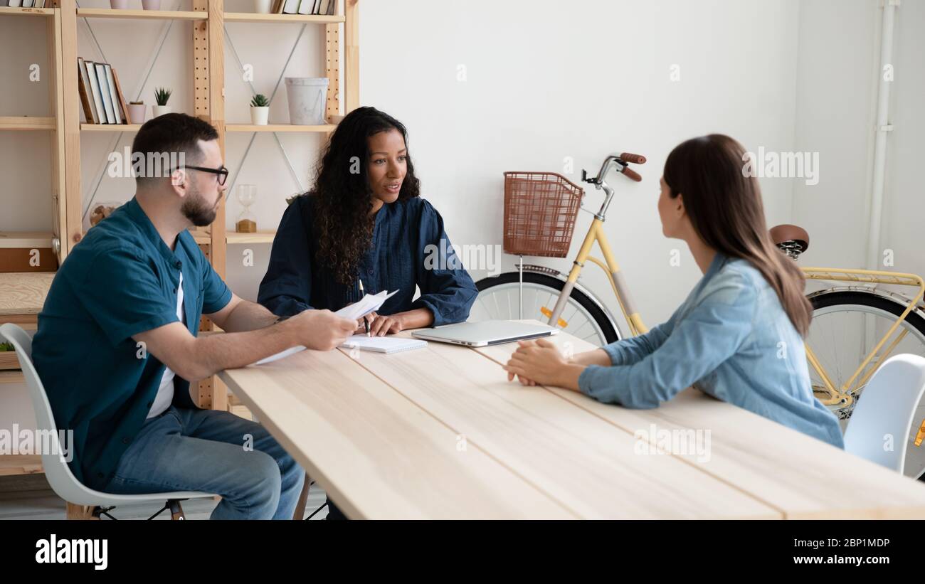 African american businesswoman and businessman with cv interviews new woman. Stock Photo