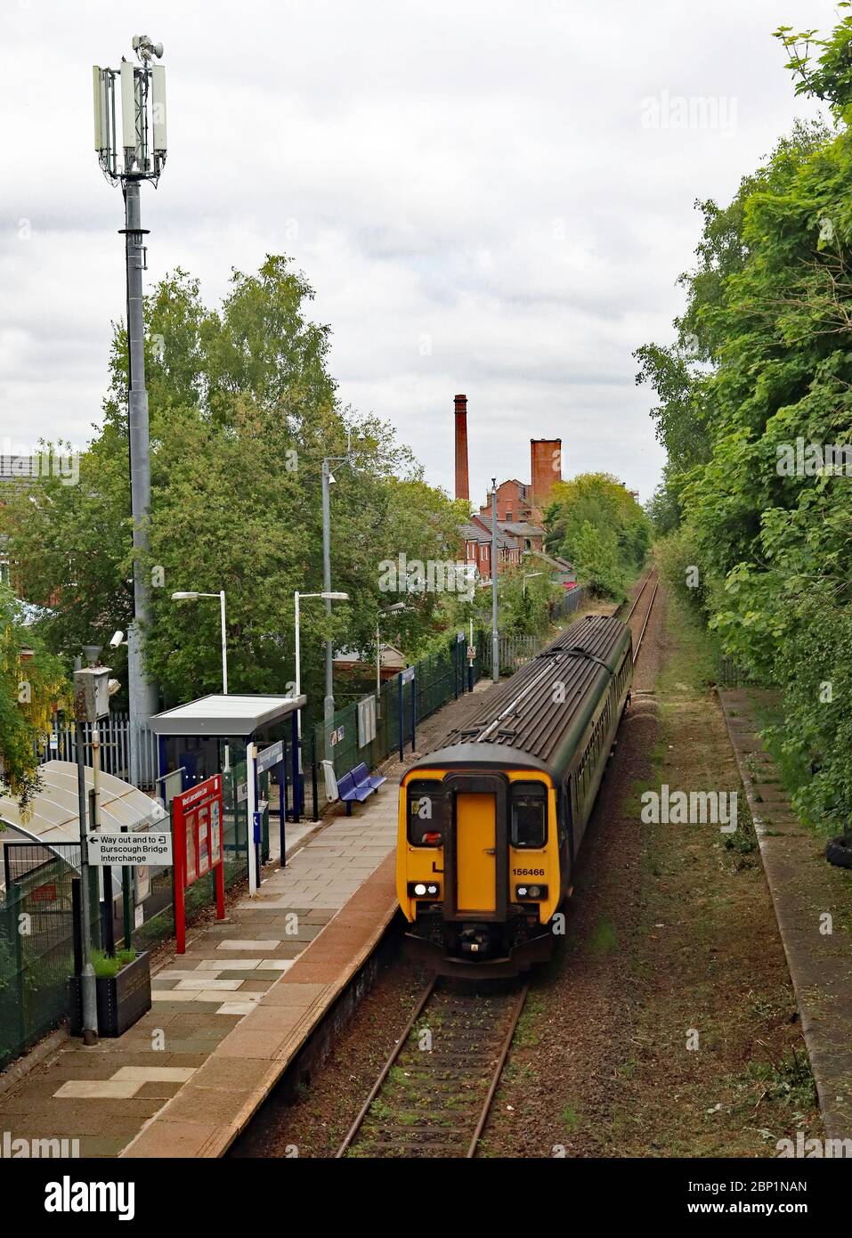 A train passes through Burscough Junction station with a route refresher train in readiness for restarting passenger services along this branch line. Stock Photo