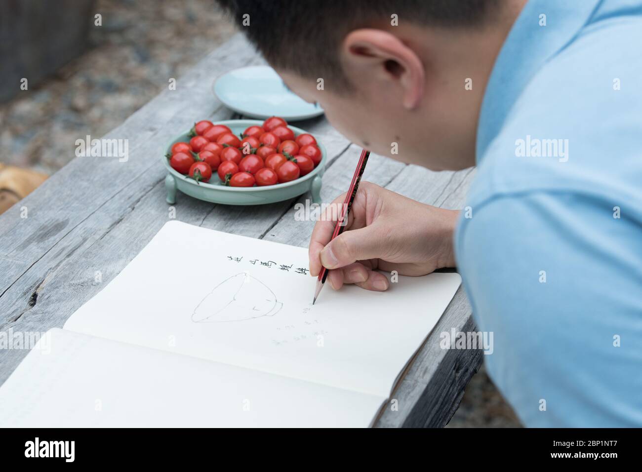 (200517) -- HANGZHOU, May 17, 2020 (Xinhua) -- Liu Jie works on the replica of Bakohan at his studio in Longquan, east China's Zhejiang Province, May 7, 2020. Liu Jie, 35 and a renowned ceramist in Longquan, began to replicate Bakohan since 2019. He has so far made over 500 replicas in an effort to approach perfection. 'I wish to replicate its beauty.' said Liu. Bakohan is a tea bowl made in Longquan, China, and gifted to Japan during the Southern Song Dynasty (1127-1279). During the era of Ming Dynasty (1368-1644), Bakouhan was found to have cracks and was then sent to China to be fixed. Th Stock Photo