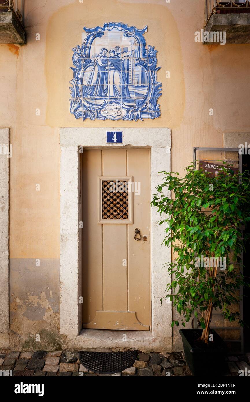 Antique Azulejo Tiles above an ancient doorway in Lisbon Portugal Stock Photo