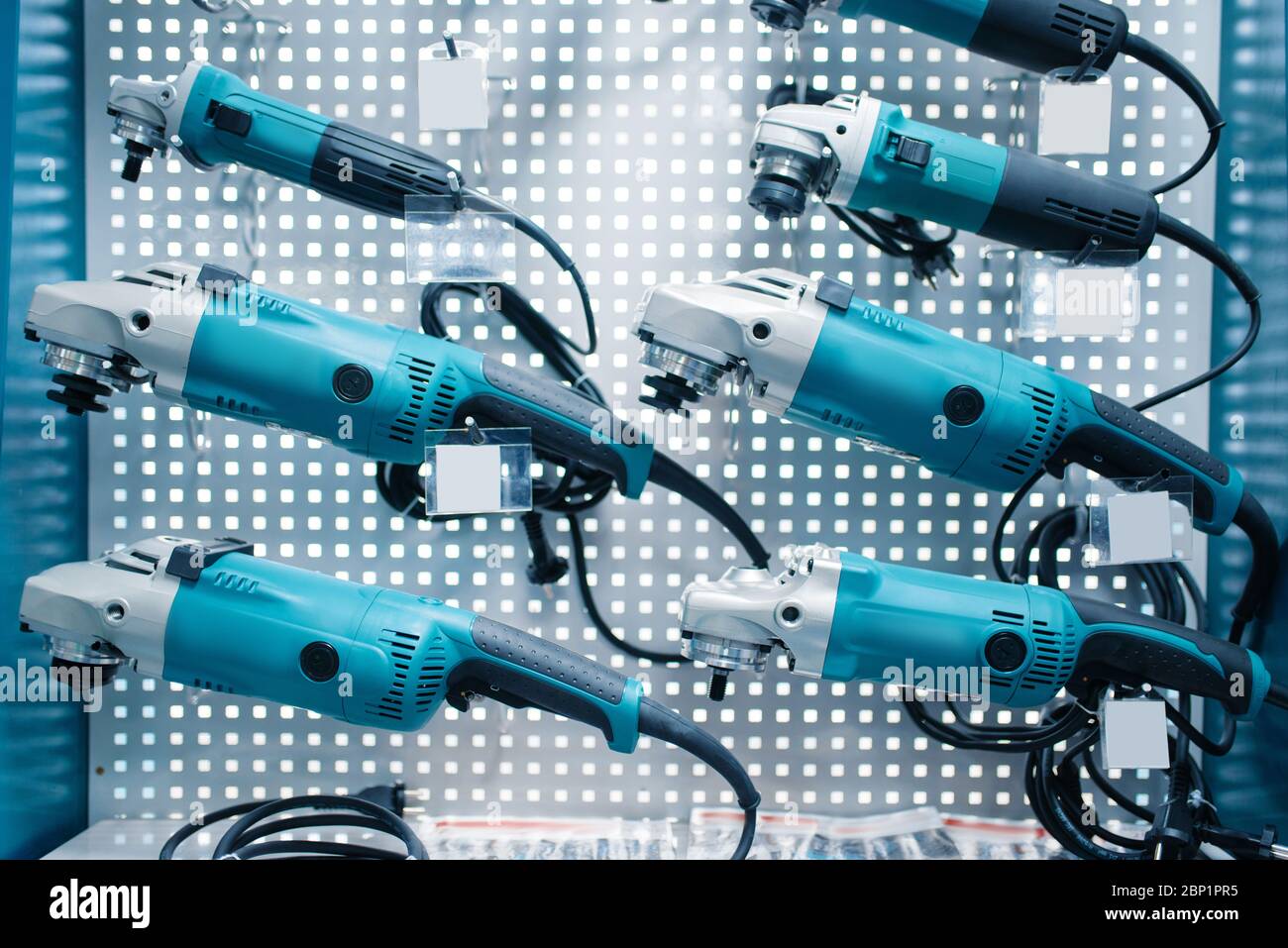 Showcase with angle grinders in power tool store Stock Photo - Alamy