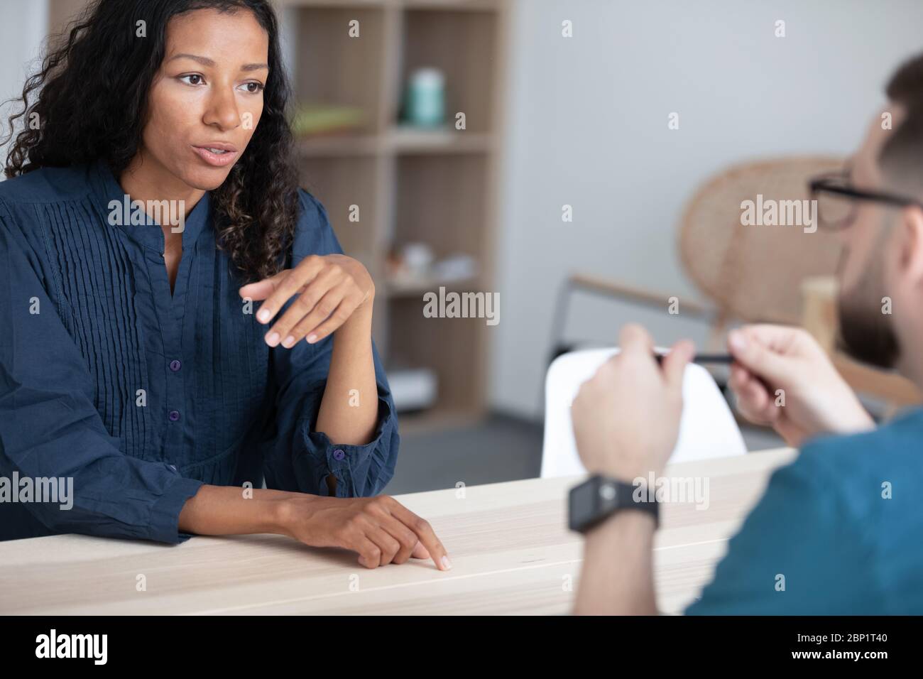 Close up confident african american woman applicant talking with hr. Stock Photo
