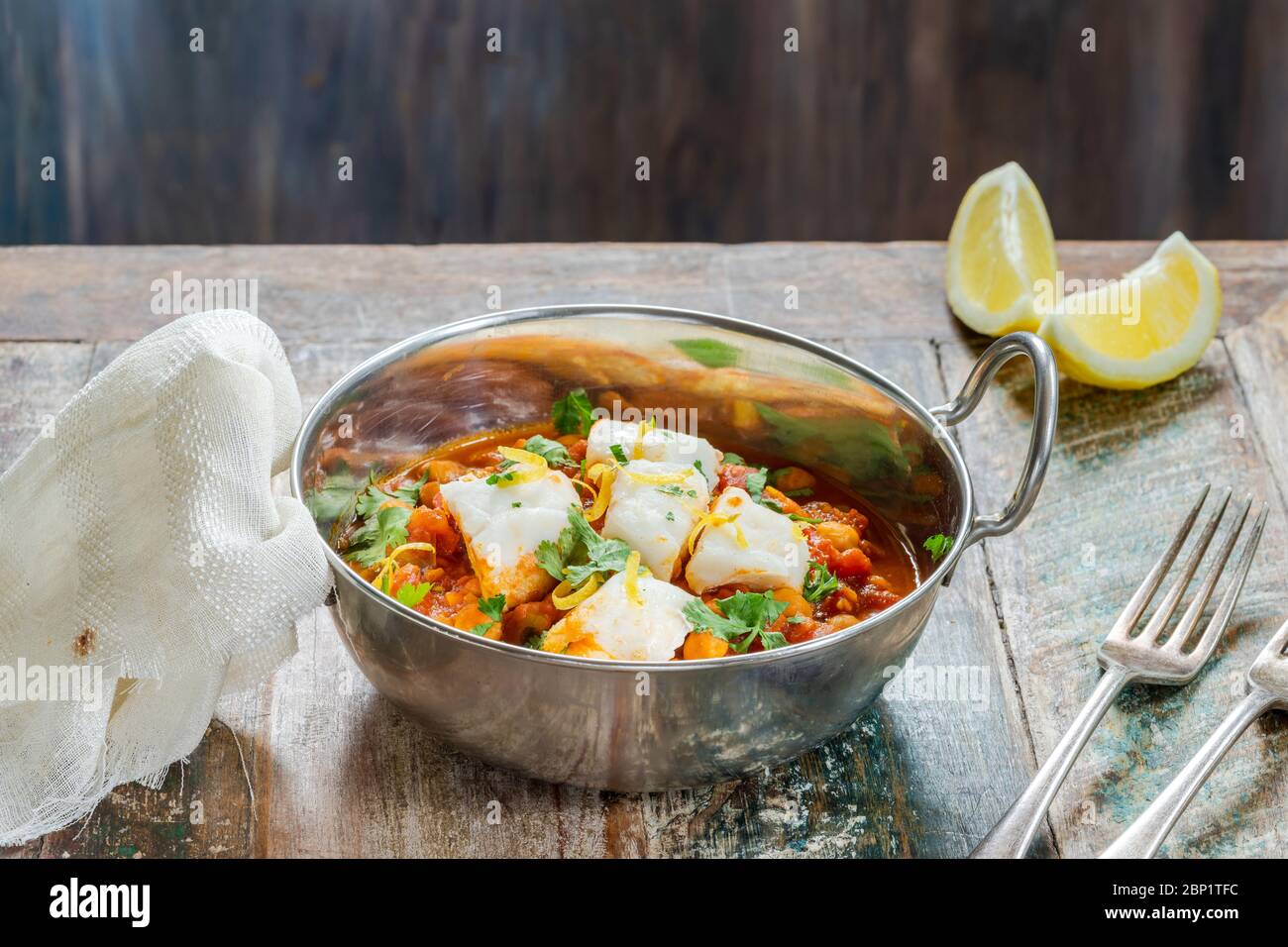 Curried cod with chickpeas and fresh coriander Stock Photo Alamy