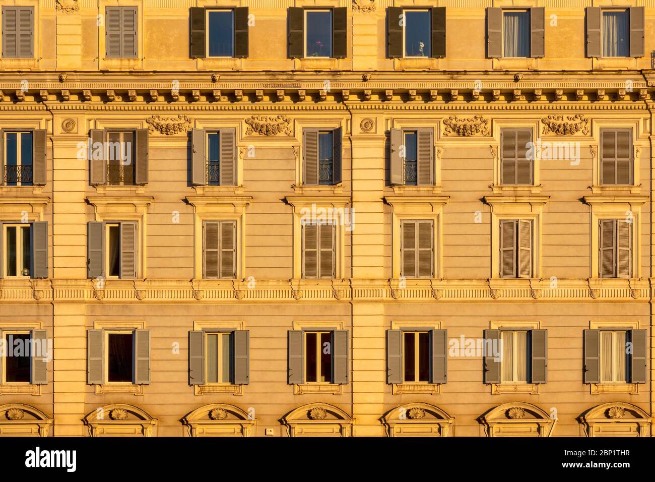 Typical residential condominiums in Rome’s city centre illuminated by the light of dawn, Rome Italy Stock Photo