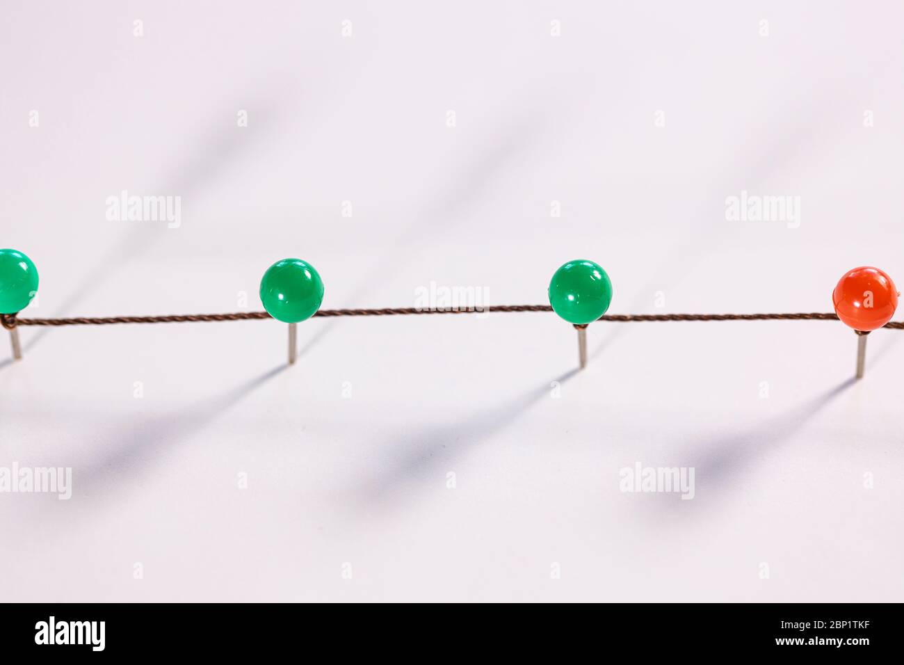 Line of thumbtacks. Social distancing concept Stock Photo