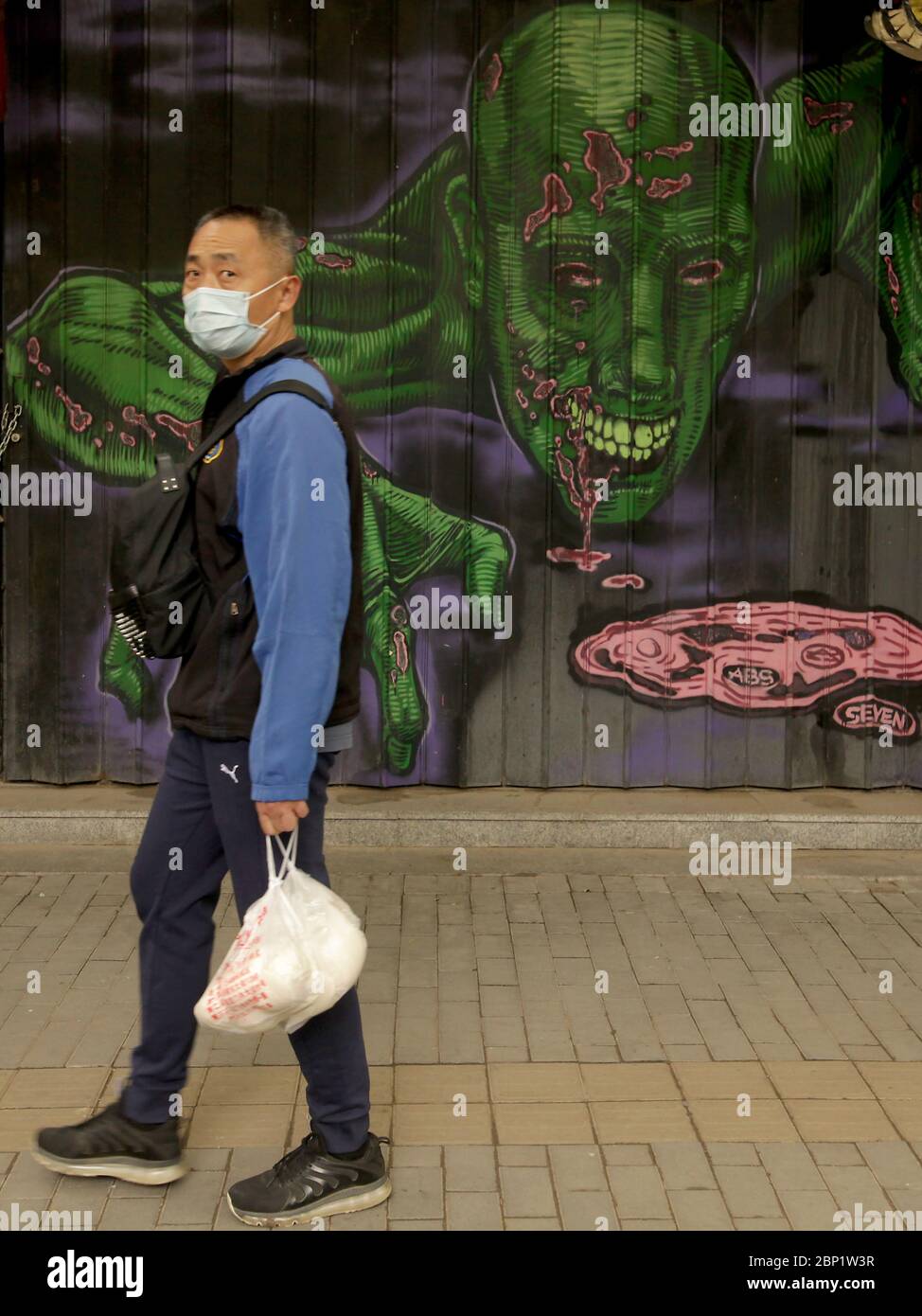 Beijing, China. 17th May, 2020. Chinese continue wearing protective face masks outside as the coronavirus pandemic threat continues in Beijing on Sunday, May 17, 2020. Wuhan, a city of 11 million, where the Covid-19 pandemic originated, reported new cases over the weekend, its first new infections in over a month. China is aggressively investigating the new cluster, announcing a plan to test the entire city in 10 days. Photo by Stephen Shaver/UPI Credit: UPI/Alamy Live News Stock Photo