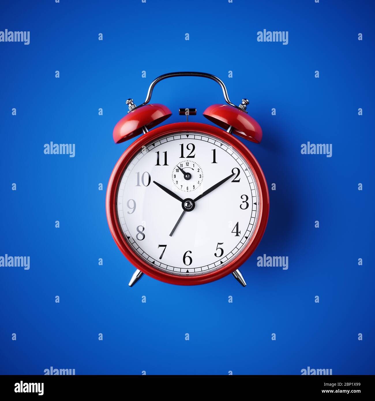 Classic red table clock on a blue background. 3d render illustration ...