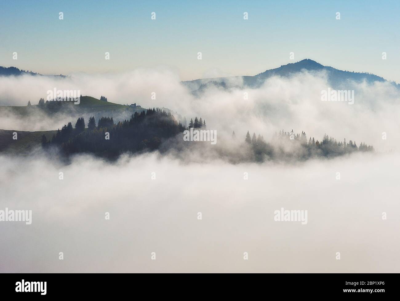 Predawn time in the highlands. mountain silhouettes in the fog Stock Photo