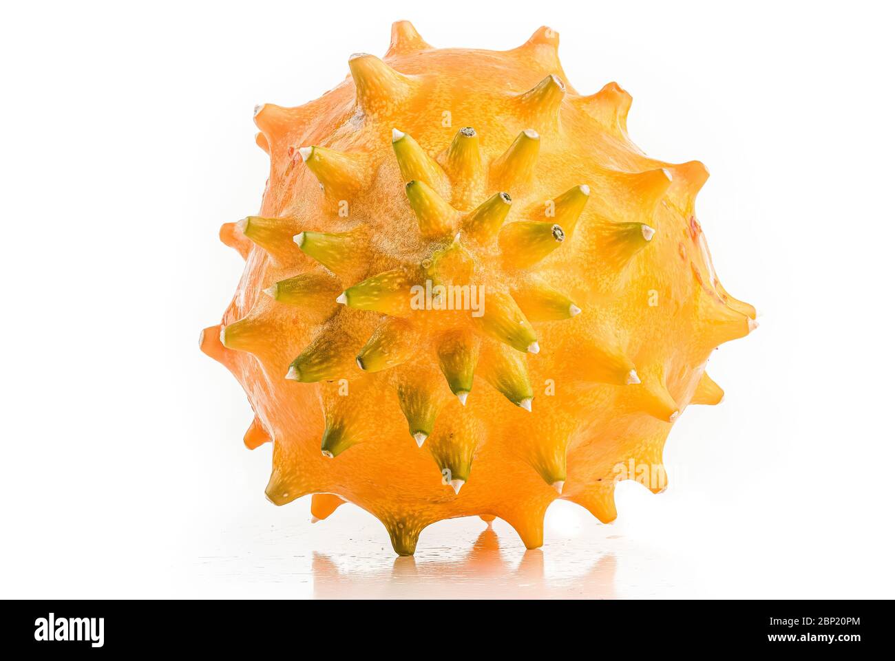 Kiwano or Horned Melon Cucumis metuliferus detailed skin shoot on white