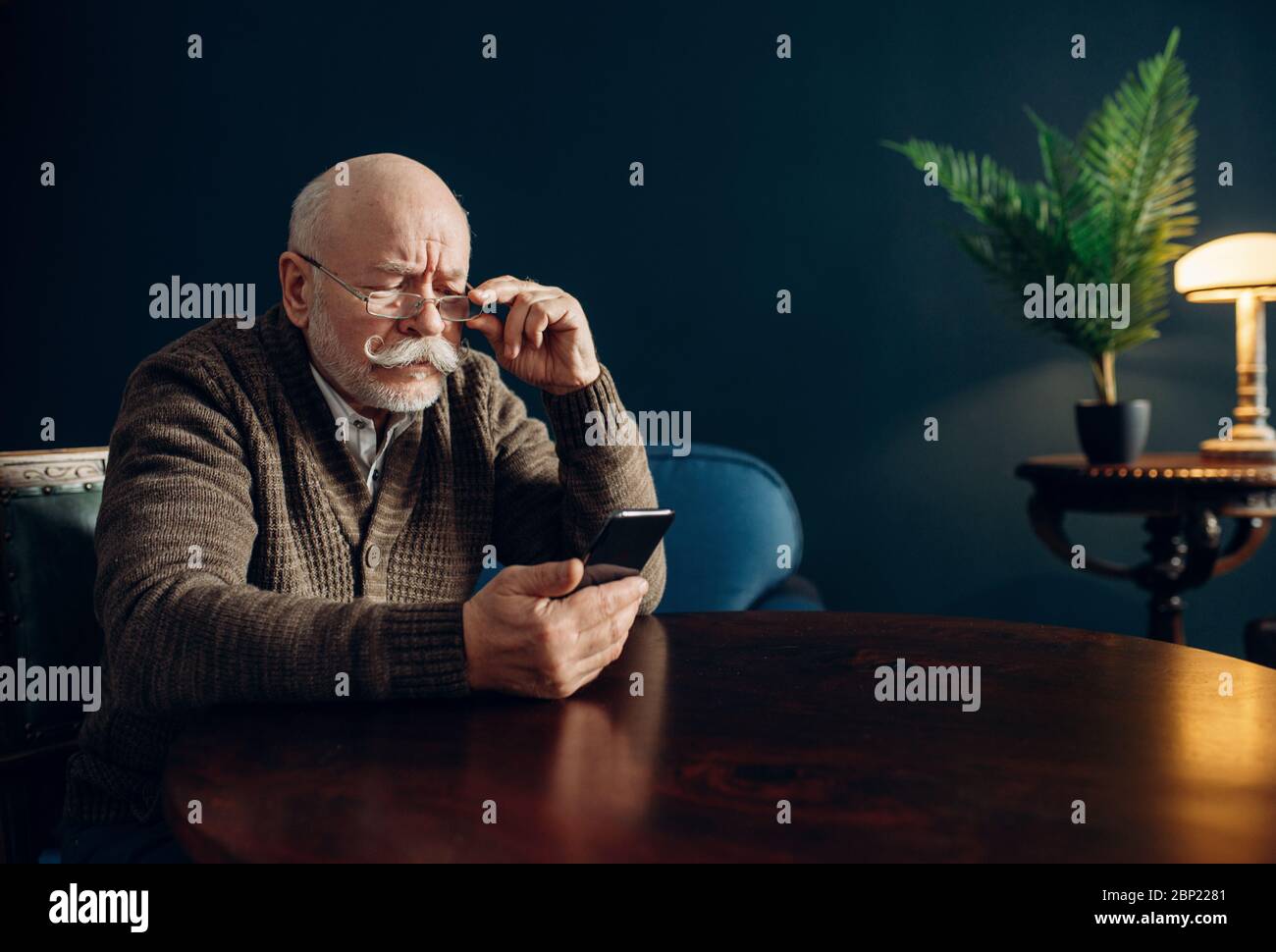 Man using smart phone in cool office hi-res stock photography and ...