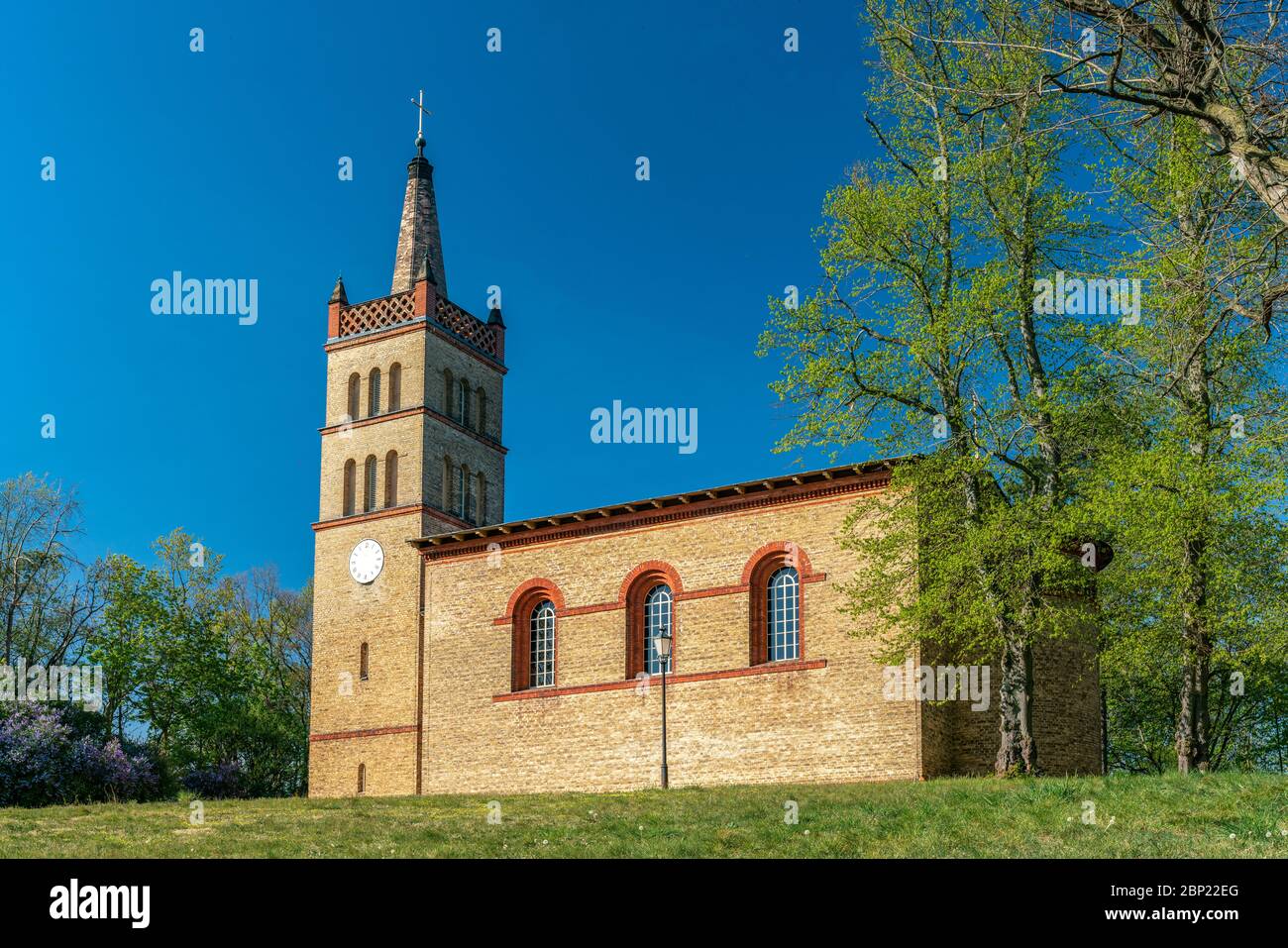 The historical village church in Petzow, Brandenburg, Germany on a bright sunny spring day Stock Photo