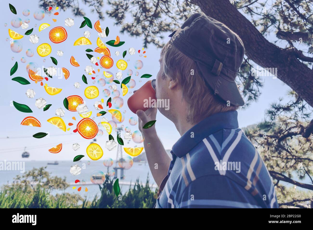 composite image of man drinking canned juice with citrus fruits and ice cubes flying around Stock Photo