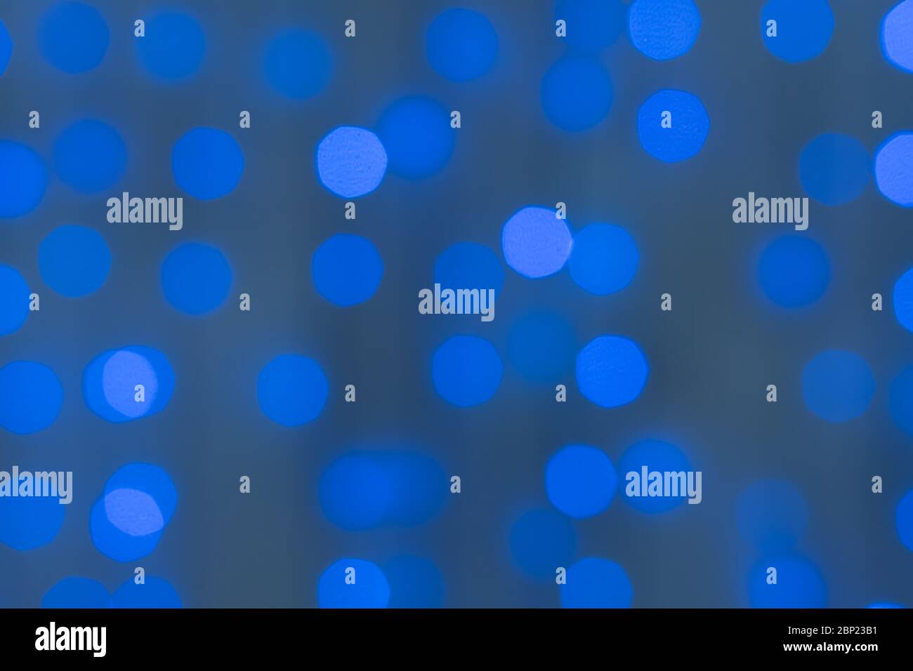 Decorative blue LED lights on wires Defocused background Stock Photo