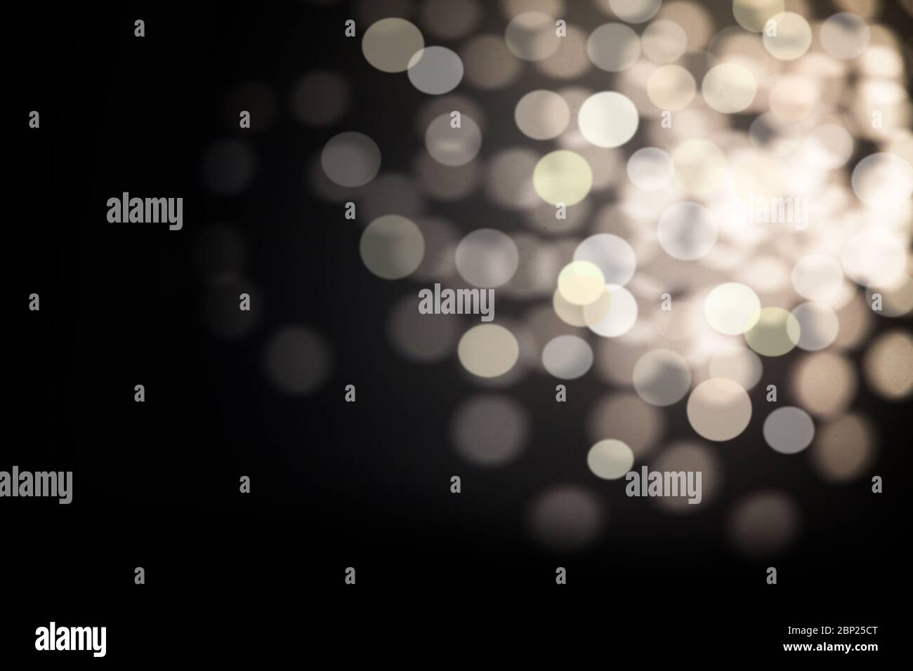 Dark Abstract silver bokeh sparkle on black background Stock Photo