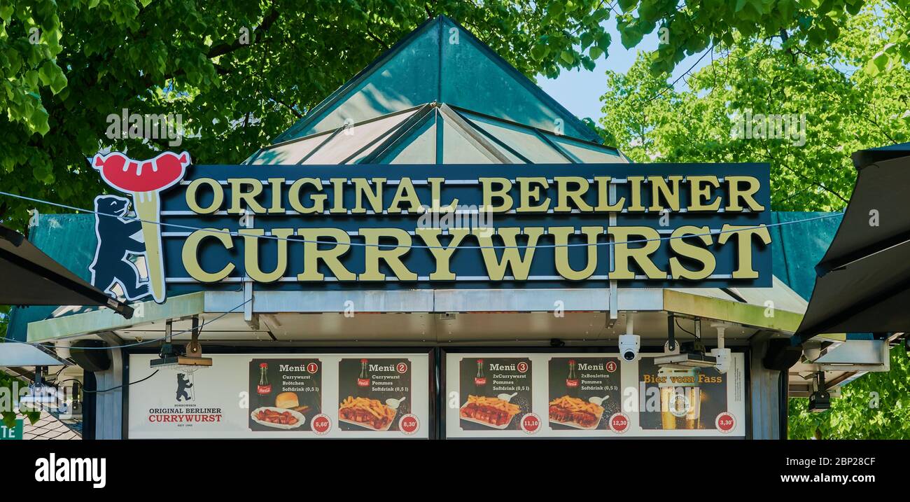 Berlin, Germany, May 6., 2020: Typical snack bar with the original Berliner Currywurst and various menus for sale Stock Photo