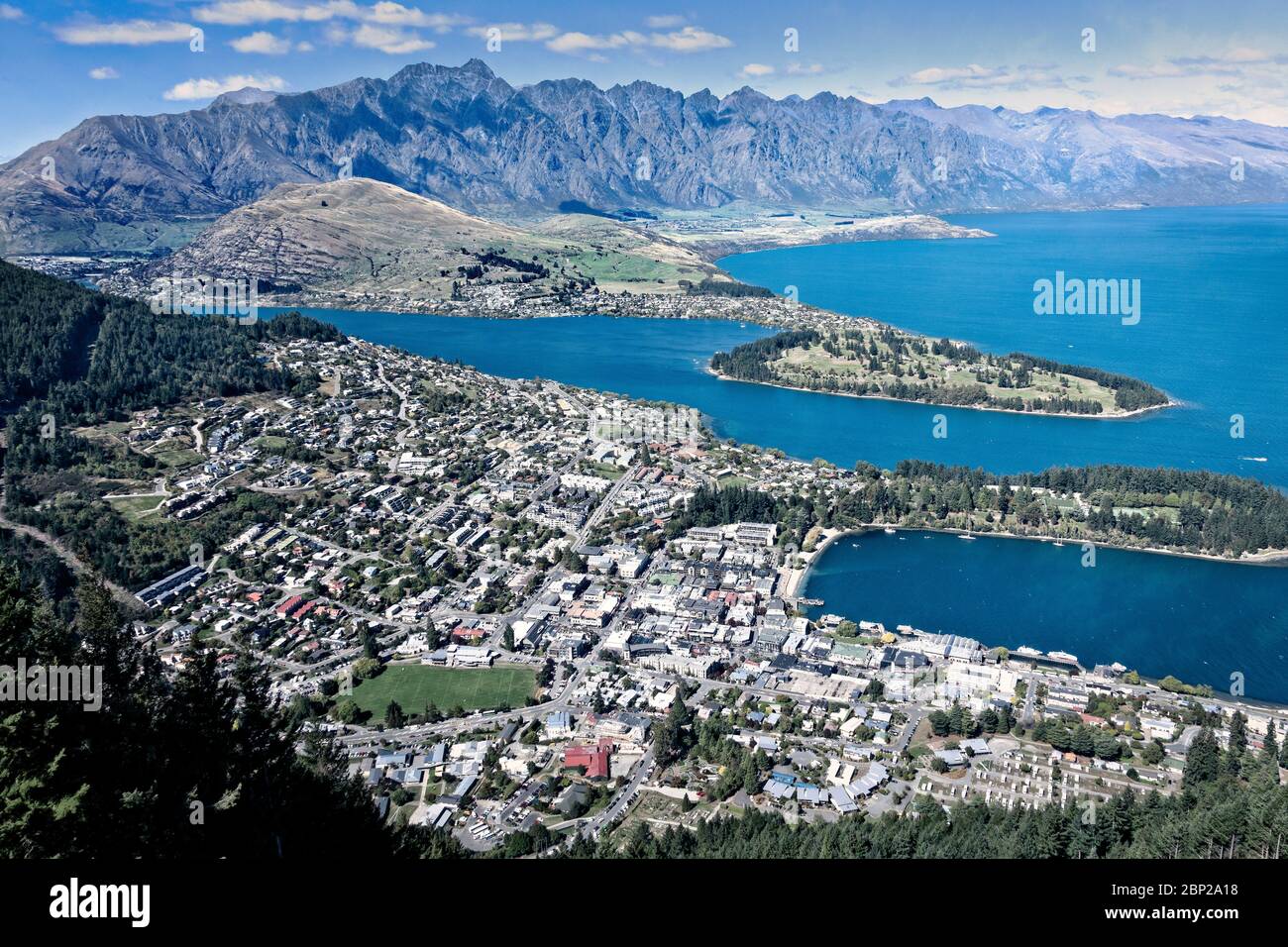 Queenstown sits on Lake Wakatipu with The Remarkables in the background, South Island, New Zealand. Stock Photo