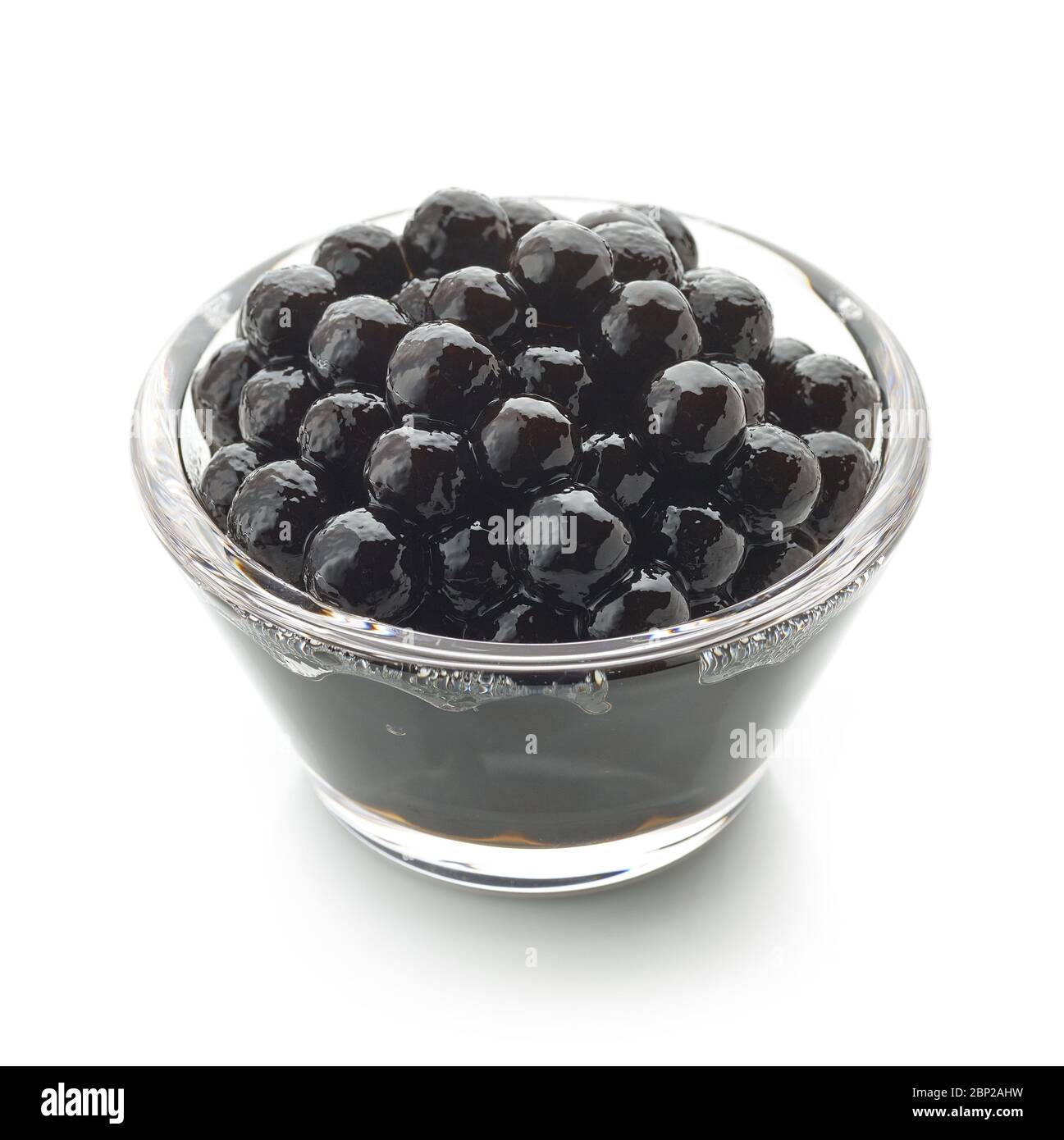 Bowl of black homemade tapioca pearls for bubble tea isolated on white