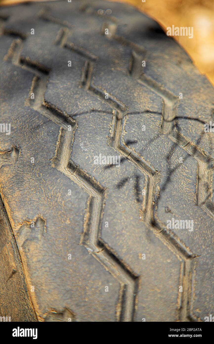 closeup of the tread pattern on a worn lorry tire Stock Photo