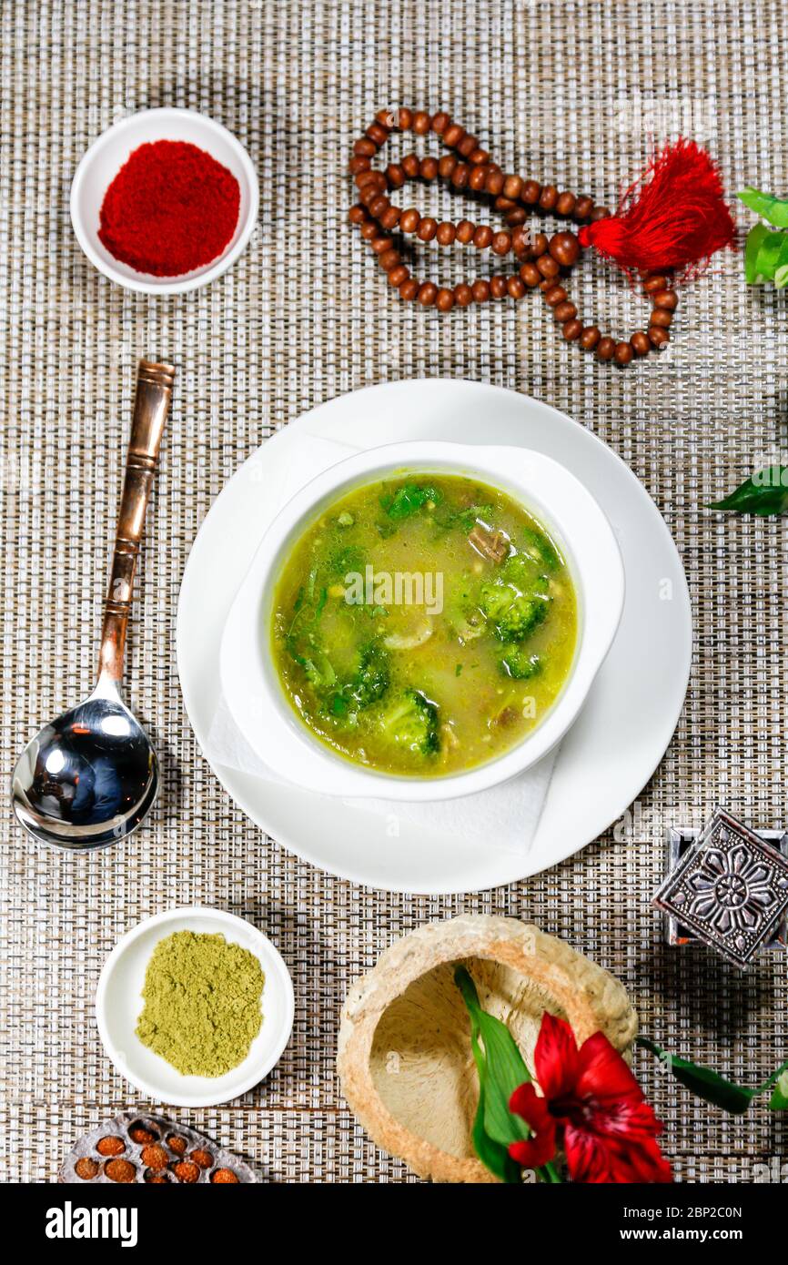 Traditional Indian vegetable soup with herbs and spices on a served