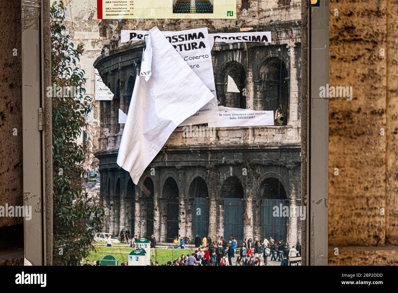 Bill depicting the Colosseum is pasted over with other posters Stock Photo