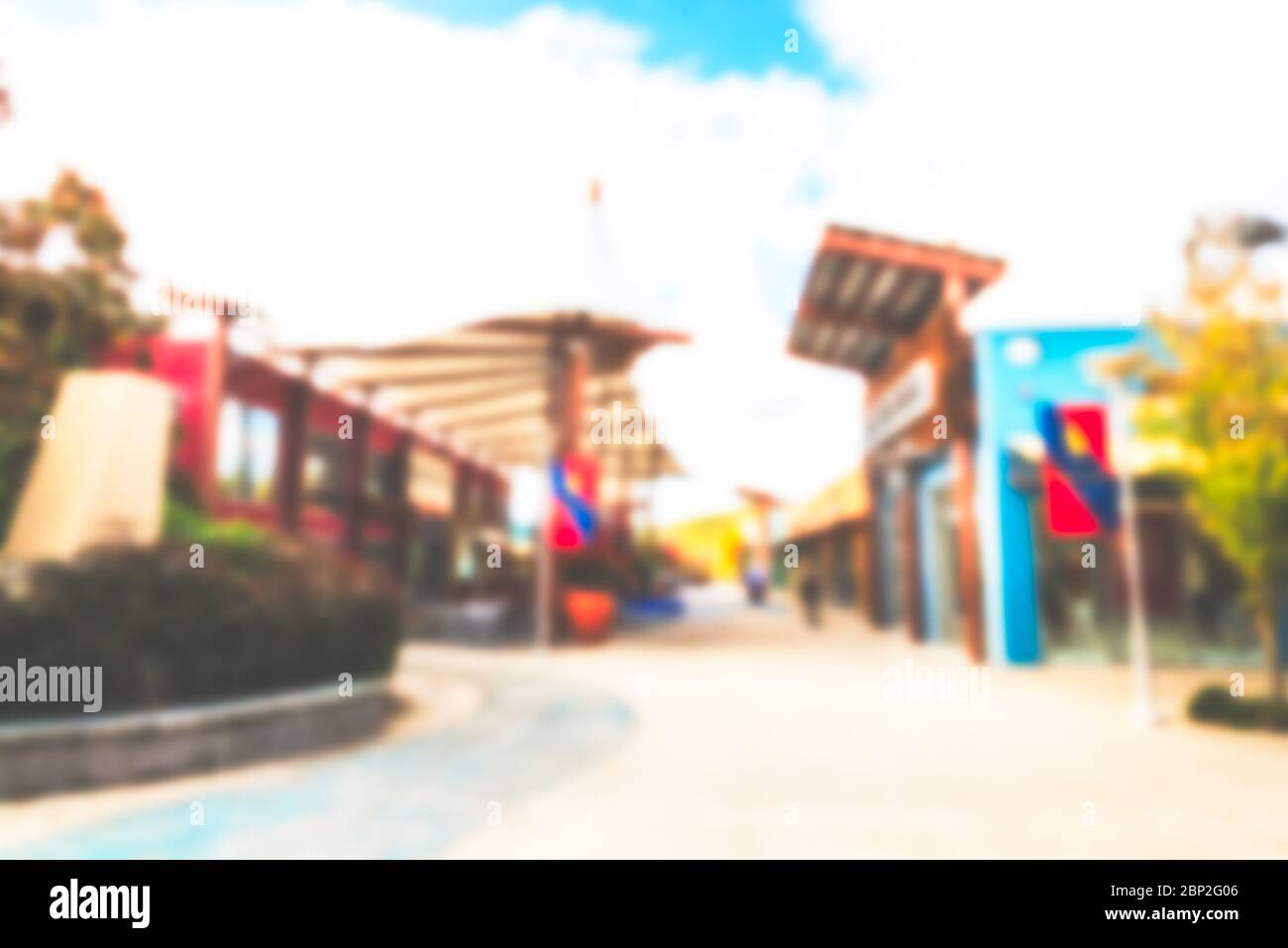 an outlet mall in open space with in sunny day. -blurred.. Stock Photo