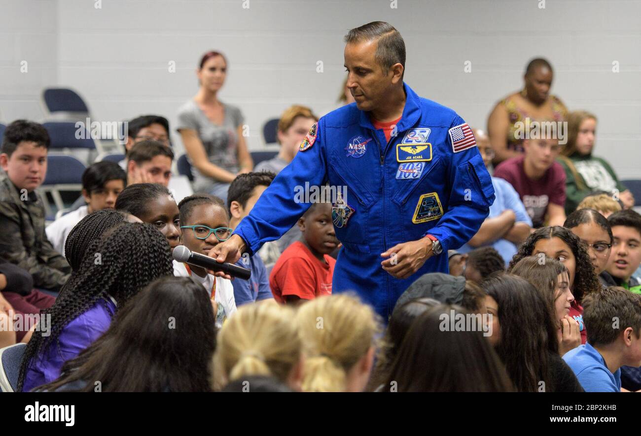 Vande Hei and Acaba at Walt Whitman Middle School  NASA astronaut Joe Acaba listens to a question from a student during a presentation at Walt Whitman Middle School, Thursday, June 14, 2018 in Alexandria, Va. Acaba and astronaut Mark Vande Hei answered questions from the audience and spoke about their experiences aboard the International Space Station for 168 days as part of Expedition 53 and 54. Stock Photo