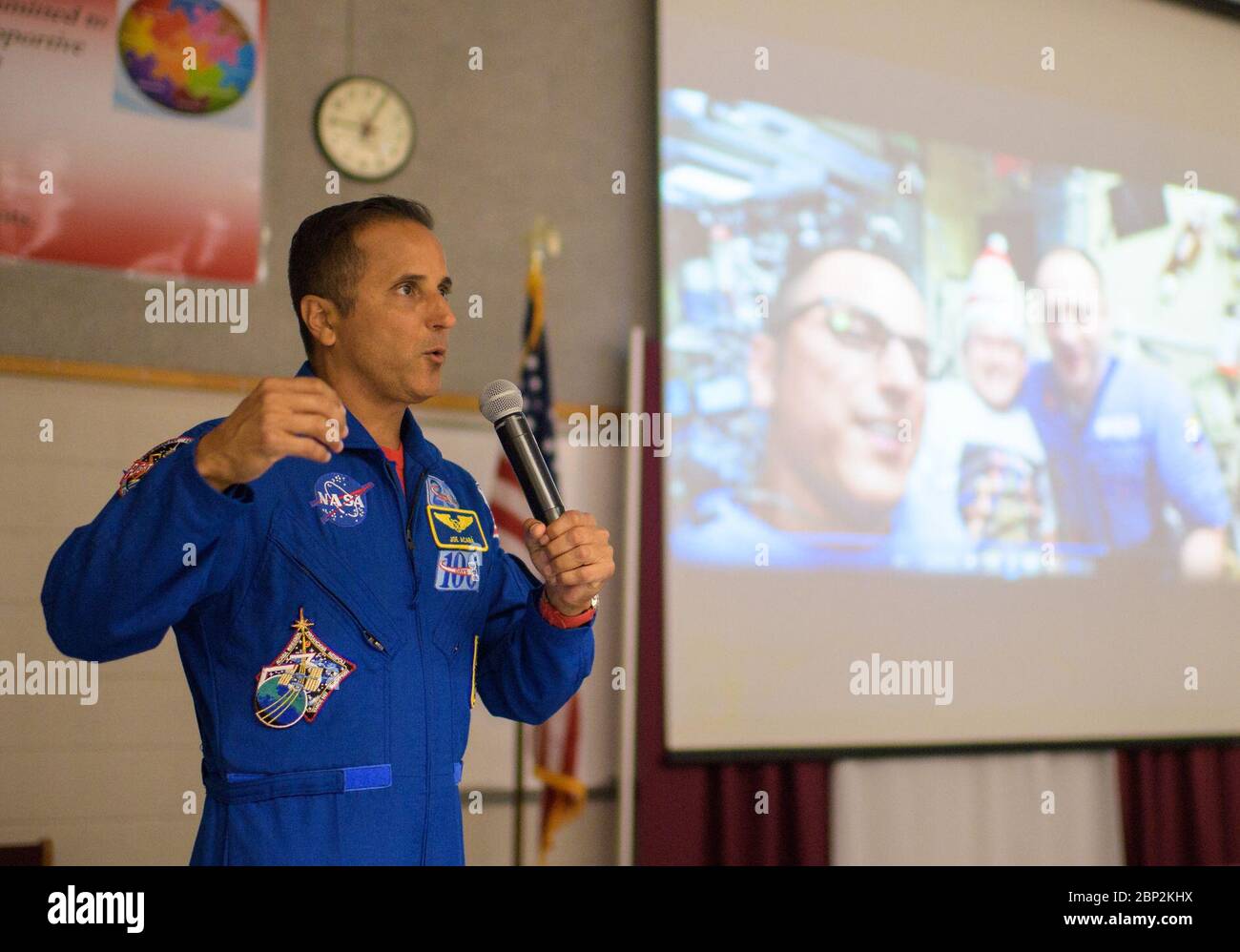 Vande Hei and Acaba at Walt Whitman Middle School  NASA astronaut Joe Acaba speaks about his time onboard the International Space Station during a presentation to students at Walt Whitman Middle School, Thursday, June 14, 2018 in Alexandria, Va. Acaba and astronaut Mark Vande Hei answered questions from the audience and spoke about their experiences aboard the International Space Station for 168 days as part of Expedition 53 and 54. Stock Photo