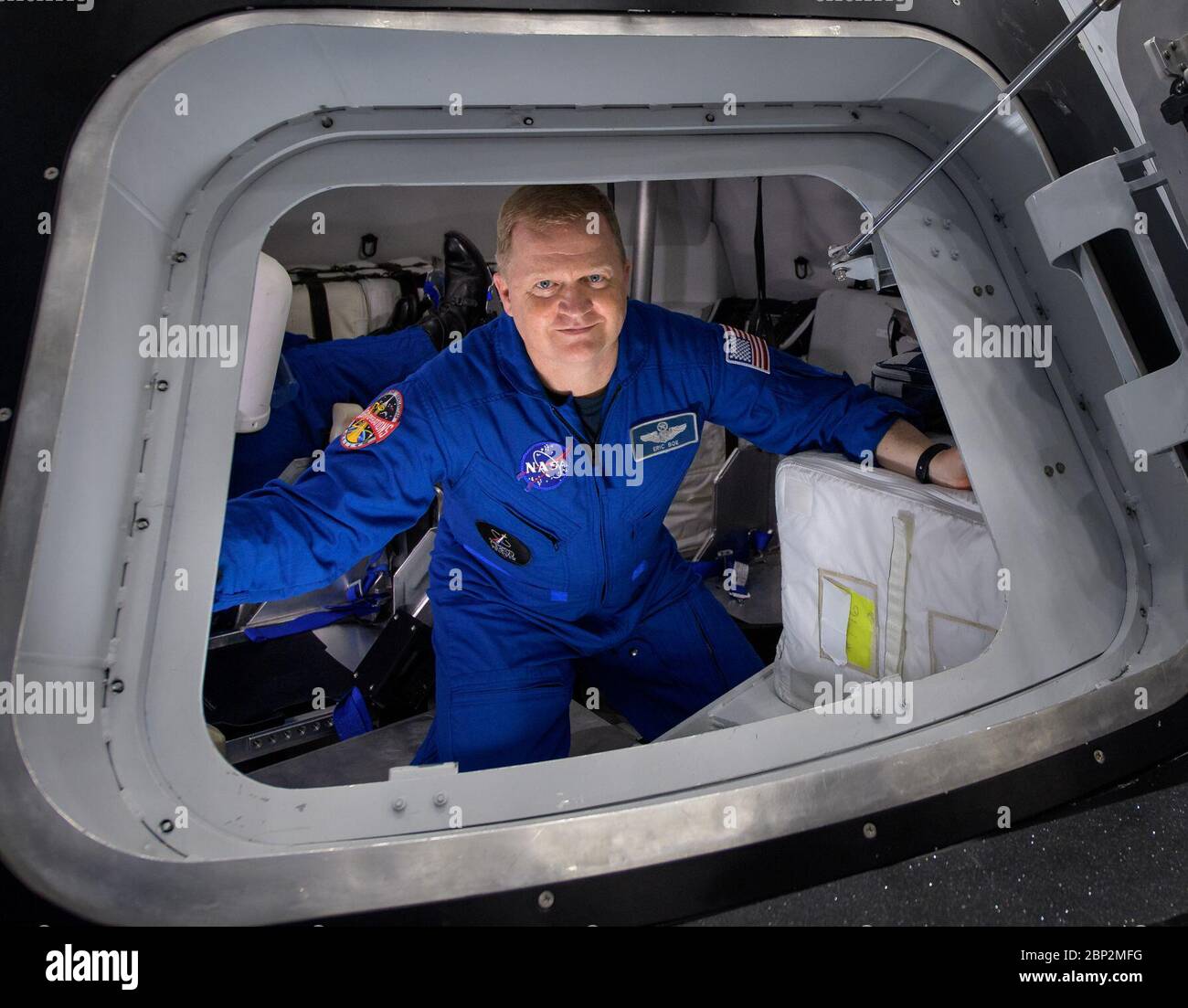 Commercial Crew Program  NASA astronaut Eric Boe poses for a photograph as he exits the Boeing Mockup Trainer at NASA’s Johnson Space Center in Houston, Texas on Aug. 2, 2018 ahead of the commercial crew flight assignments announcement Aug. 3. Boe, along with NASA astronaut Nicole Aunapu Mann and Boeing astronaut Chris Ferguson were assigned to launch aboard Boeing’s CST-100 Starliner on the company’s Crew Flight Test targeted for mid-2019 in partnership with NASA’s Commercial Crew Program. Stock Photo