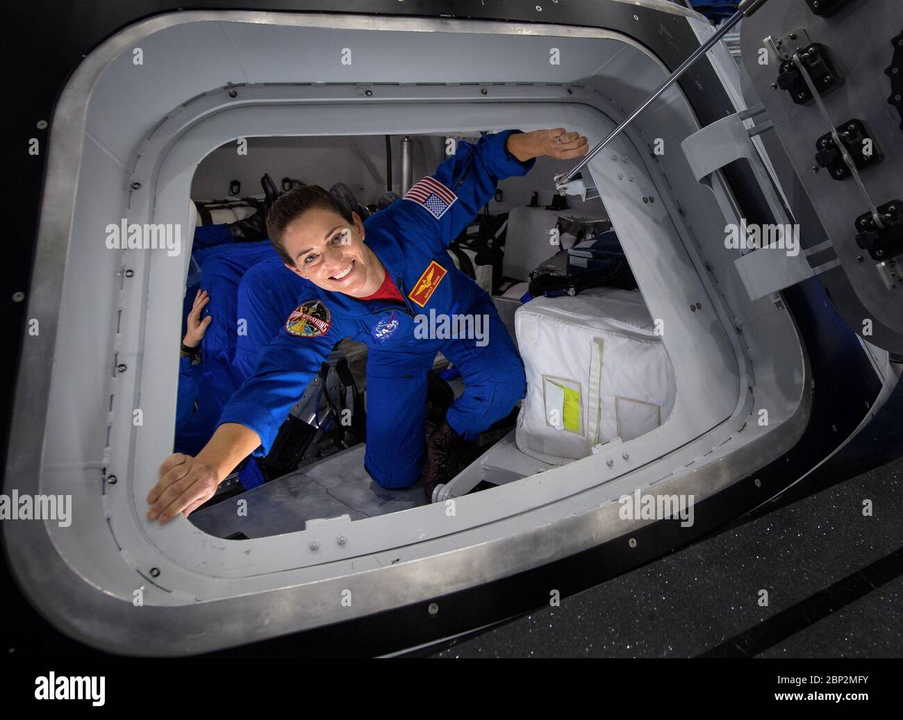 Commercial Crew Program  NASA astronaut Nicole Mann poses for a photograph as she exits the Boeing Mockup Trainer at NASA’s Johnson Space Center in Houston, Texas on Aug. 2, 2018 ahead of the commercial crew flight assignments announcement Aug. 3. Mann, along with NASA astronaut Eric Boe and Boeing astronaut Chris Ferguson were assigned to launch aboard Boeing’s CST-100 Starliner on the company’s Crew Flight Test targeted for mid-2019 in partnership with NASA’s Commercial Crew Program. Stock Photo