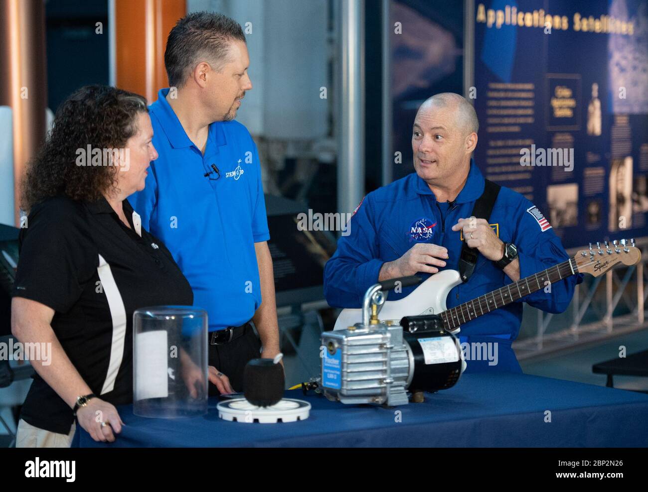 Astronaut Tingle at Udvar-Hazy Center  NASA astronaut Scott Tingle helps conduct an experiment about sound waves in a vacuum during a taping of STEM in 30 with Beth Wilson and Marty Kelsey, Wednesday, Sept. 12, 2018 at the Smithsonian National Air and Space Museum's Steven F. Udvar-Hazy Center in Chantilly, Va. Tingle spent 168 days onboard the International Space Station as part of Expeditions 54 and 55. Stock Photo