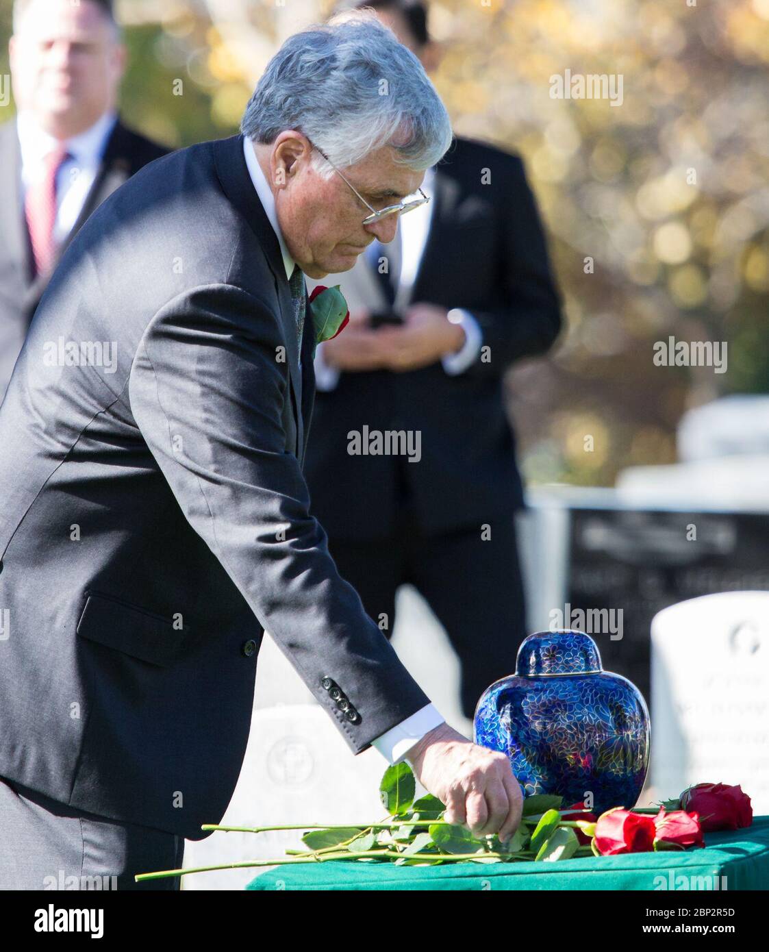 Alan Bean Interment Former astronaut Harrison Schmitt places a rose ...