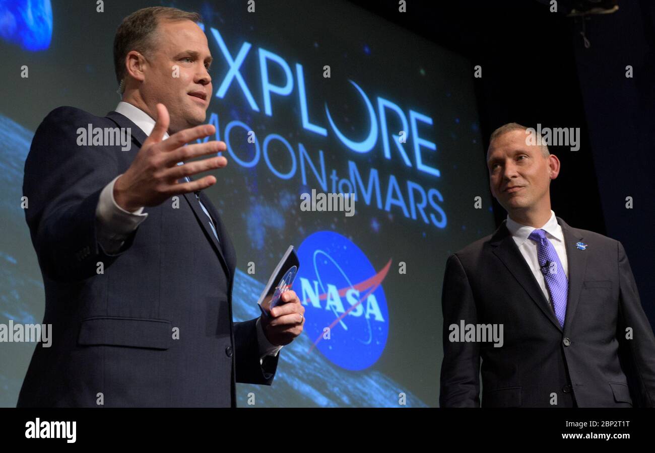 Commercial Lunar Payload Services (CLPS)  NASA Administrator Jim Bridenstine, left, and NASA Associate Administrator for the Science Mission Directorate, Thomas Zurbuchen, answer questions during an event where nine U.S. companies where named as eligible to bid on NASA delivery services to the lunar surface through Commercial Lunar Payload Services (CLPS) contracts, Thursday, Nov. 29, 2018 at NASA Headquarters in Washington. The companies will be able to bid on delivering science and technology payloads for NASA, including payload integration and operations, launching from Earth and landing on Stock Photo