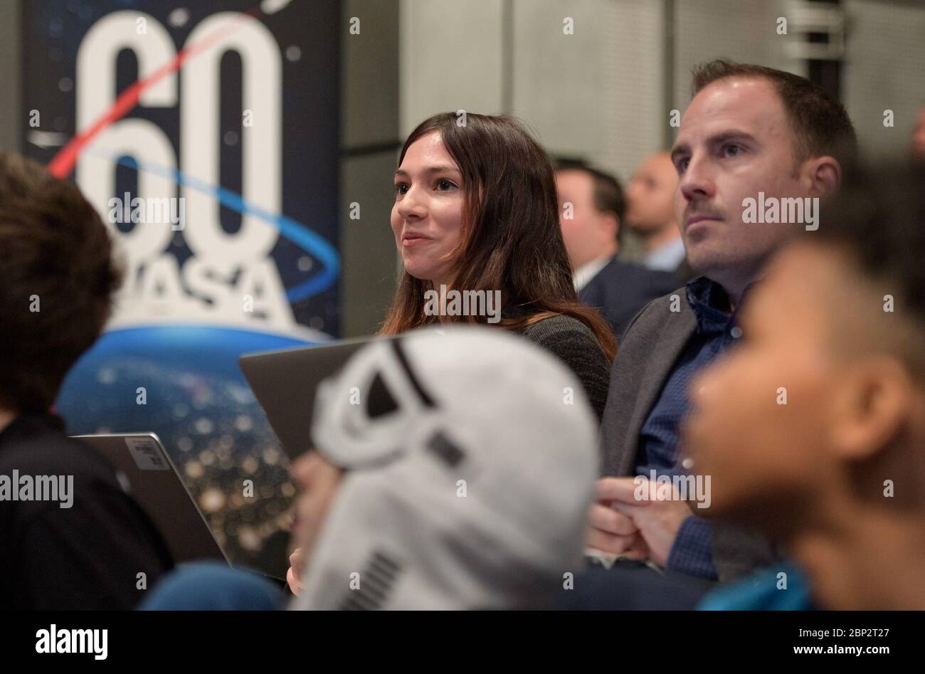 Commercial Lunar Payload Services (CLPS)  Thalia Patrinos, and Jason Townsend from NASA's Social Media Team monitor questions coming in from social media during an event where nine U.S. companies where named as eligible to bid on NASA delivery services to the lunar surface through Commercial Lunar Payload Services (CLPS) contracts, Thursday, Nov. 29, 2018 at NASA Headquarters in Washington. The companies will be able to bid on delivering science and technology payloads for NASA, including payload integration and operations, launching from Earth and landing on the surface of the Moon. NASA expe Stock Photo