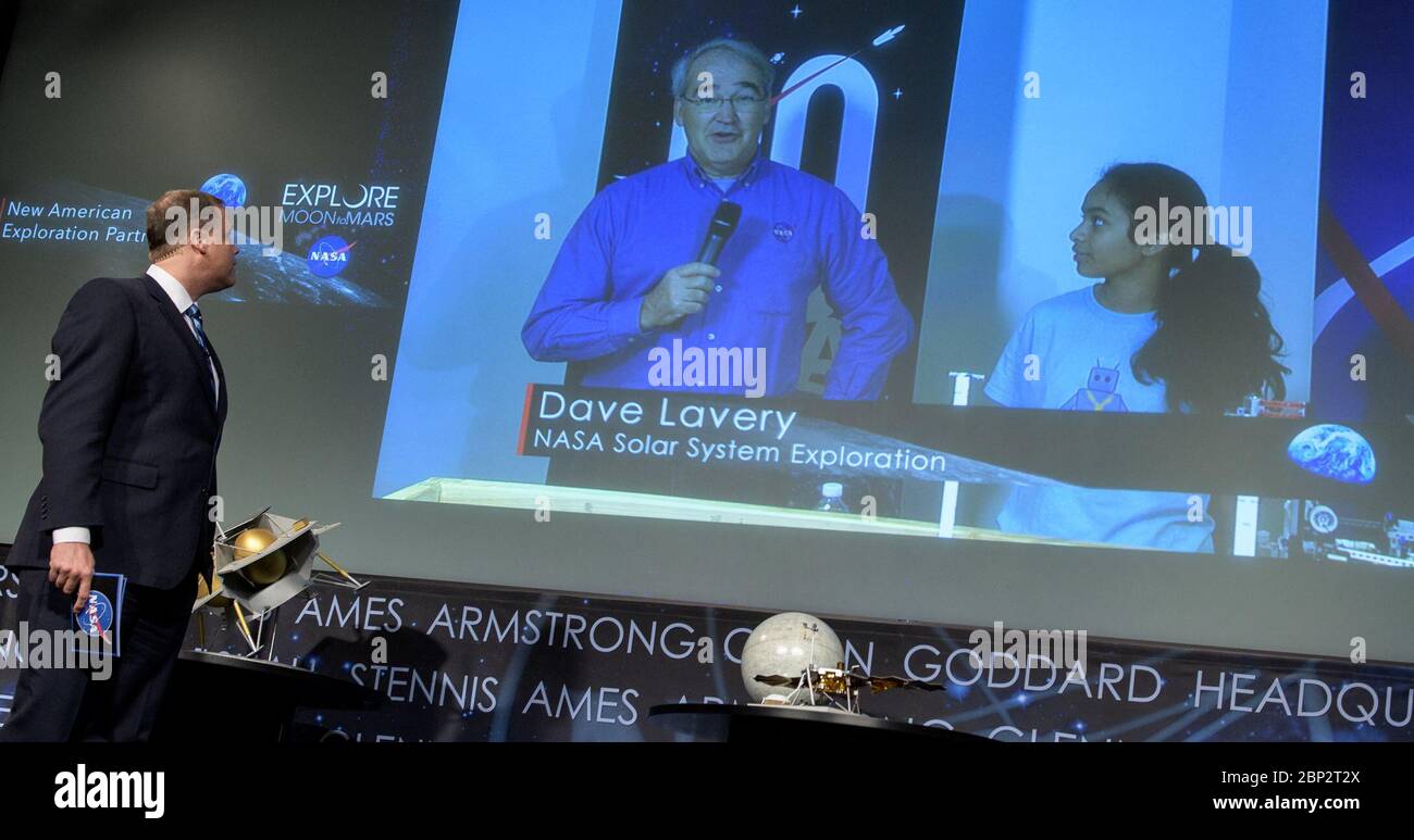 Commercial Lunar Payload Services (CLPS)  NASA Administrator Jim Bridenstine talks with Dave Lavery, Program Executive for Solar System Exploration, and Dishaa Bhat, 14, from Mary Henderson Middle School in Falls Church, Virginia, during a event where it was announced that nine U.S. companies are eligible to bid on NASA delivery services to the lunar surface through Commercial Lunar Payload Services (CLPS) contracts, Thursday, Nov. 29, 2018 at NASA Headquarters in Washington. The companies will be able to bid on delivering science and technology payloads for NASA, including payload integration Stock Photo