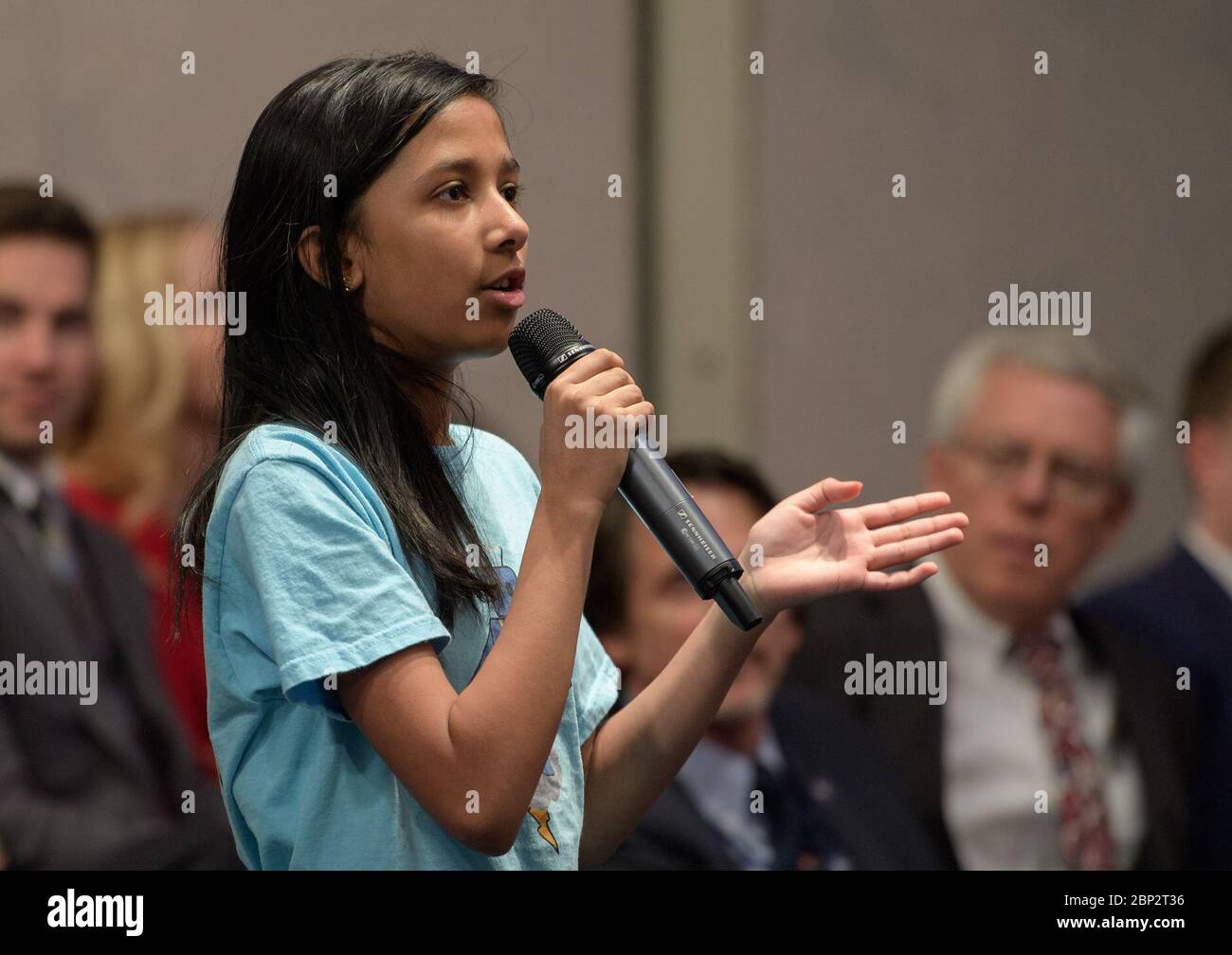 Commercial Lunar Payload Services (CLPS)  A Cascades Thunderbots &quot;Robotics for Youth&quot; team member from Sterling, Virginia asks a question during an Commercial Lunar Payload Services (CLPS) announcement, Thursday, Nov. 29, 2018 at NASA Headquarters in Washington. Nine companies will be able to bid on delivering science and technology payloads for NASA, including payload integration and operations, launching from Earth and landing on the surface of the Moon. NASA expects to be one of many customers that will use these commercial landing services. Stock Photo