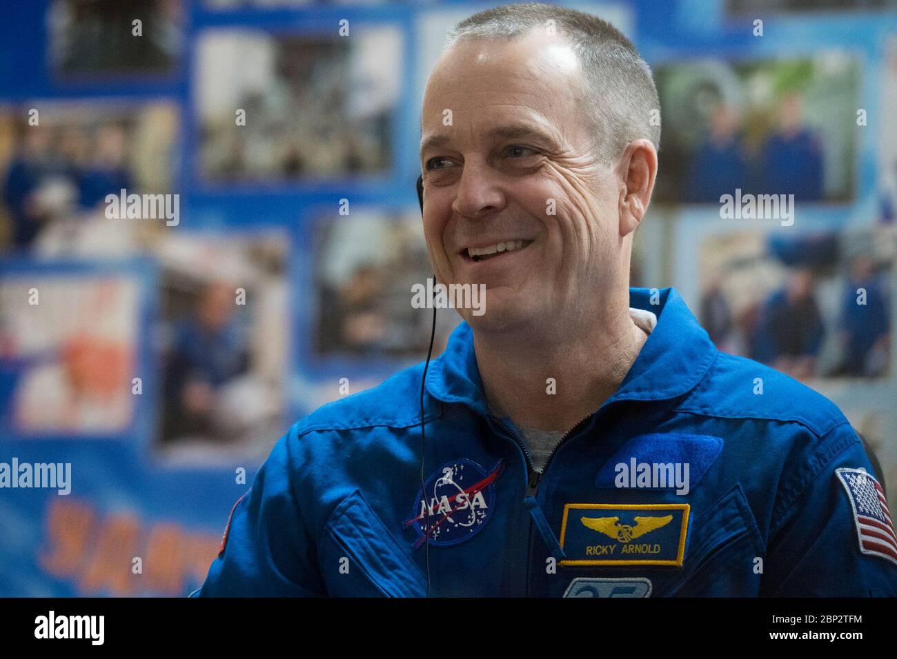 Expedition 55 Press Conference  Expedition 55 flight engineer Ricky Arnold of NASA is seen in quarantine, behind glass, during a press conference, Tuesday, March 20, 2018 at the Cosmonaut Hotel in Baikonur, Kazakhstan. Arnold, Soyuz Commander Oleg Artemyev of Roscosmos, flight engineer Drew Feustel of NASA are scheduled to launch to the International Space Station aboard the Soyuz MS-08 spacecraft on Wednesday, March, 21. Stock Photo