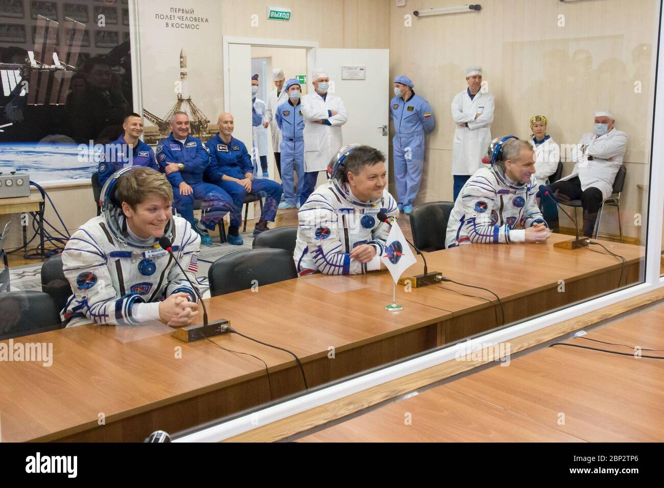 Expedition 58 Pressure Checks  Expedition 58 crew, from left to right, Flight Engineer Anne McClain of NASA, Soyuz Commander Oleg Kononenko of Roscosmos, and Flight Engineer David Saint-Jacques of the Canadian Space Agency (CSA) speak to family and friends after having their Russian Sokol suits pressure checked in preparation for their launch aboard the Soyuz MS-11 spacecraft on Monday, Dec. 3, 2018, at the Baikonur Cosmodrome in Kazakhstan. Launch of the Soyuz rocket is scheduled for the same day and will carry Kononenko, Saint-Jacques, and McClain into orbit to begin their six and a half mon Stock Photo