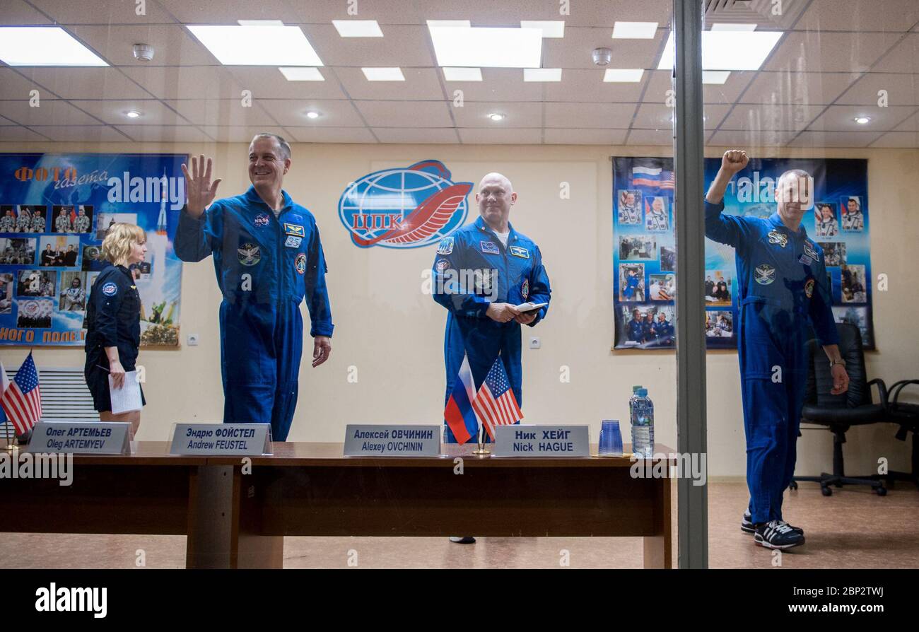 Expedition 55 Press Conference  Expedition 55 flight engineer Ricky Arnold of NASA, left, Soyuz Commander Oleg Artemyev of Roscosmos, center, and flight engineer Drew Feustel of NASA, right, are seen at the conclusion of a press conference, Tuesday, March 20, 2018 at the Cosmonaut Hotel in Baikonur, Kazakhstan. Arnold, Artemyev, and Feustel are scheduled to launch to the International Space Station aboard the Soyuz MS-08 spacecraft on Wednesday, March, 21. Stock Photo