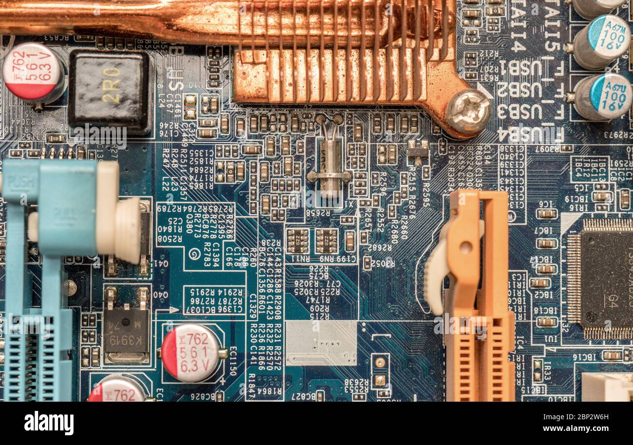 Computer Motherboard background with power connector socket Circuit board close-up blue texture Stock Photo