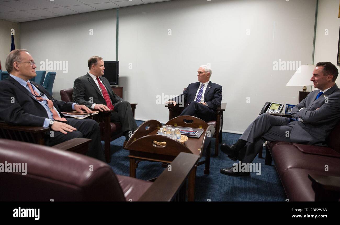 Vice President Pence Visits NASA Headquarters  NASA Administrator Jim Bridenstine, second from left speaks with Vice President Mike Pence, second from right, Scott Pace, Executive Director of the National Space Council, left, and acting Chief of Staff to the Vice President, Jarrod Agen, right, prior to a meeting with NASA leadership about the progress on Space Policy Directive 1 (SPD-1), Wednesday, Dec. 12, 2018 at NASA Headquarters in Washington. Stock Photo