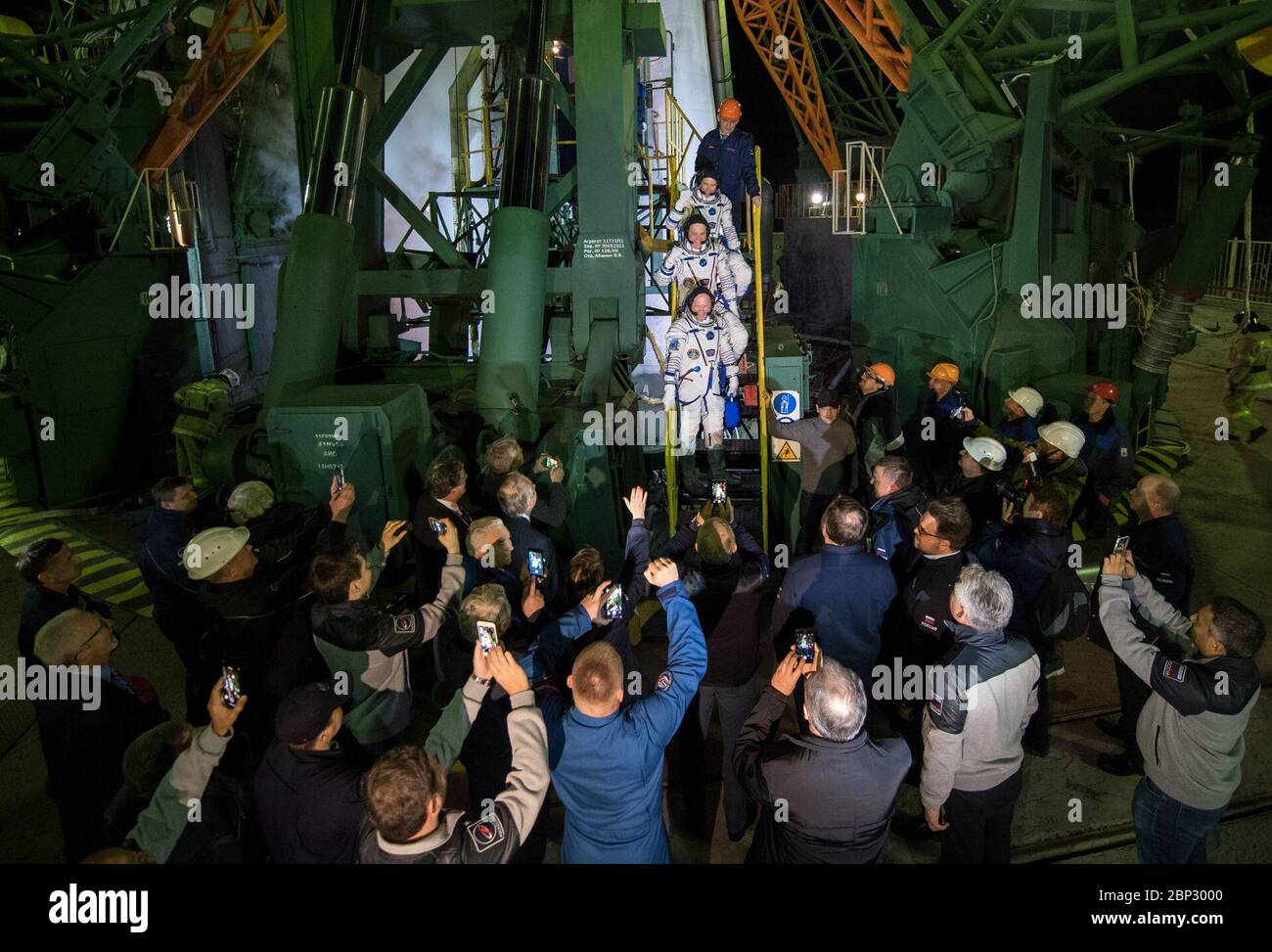 Expedition 55 Preflight  Expedition 55 flight engineer Drew Feustel of NASA, top, flight engineer Ricky Arnold of NASA, middle, and Soyuz Commander Oleg Artemyev of Roscosmos, bottom, wave farewell prior to boarding the Soyuz MS-08 spacecraft for launch, Wednesday, March 21, 2018 at the Baikonur Cosmodrome in Kazakhstan. Feustel, Arnold, and Artemyev will spend the next five months living and working aboard the International Space Station. Stock Photo