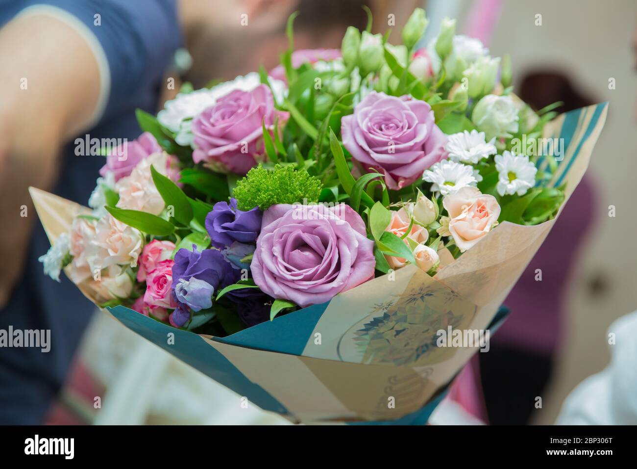 multi-colored paper bouquet blurrd backgrounds . Rosa Mainzer Fastnacht . Stock Photo