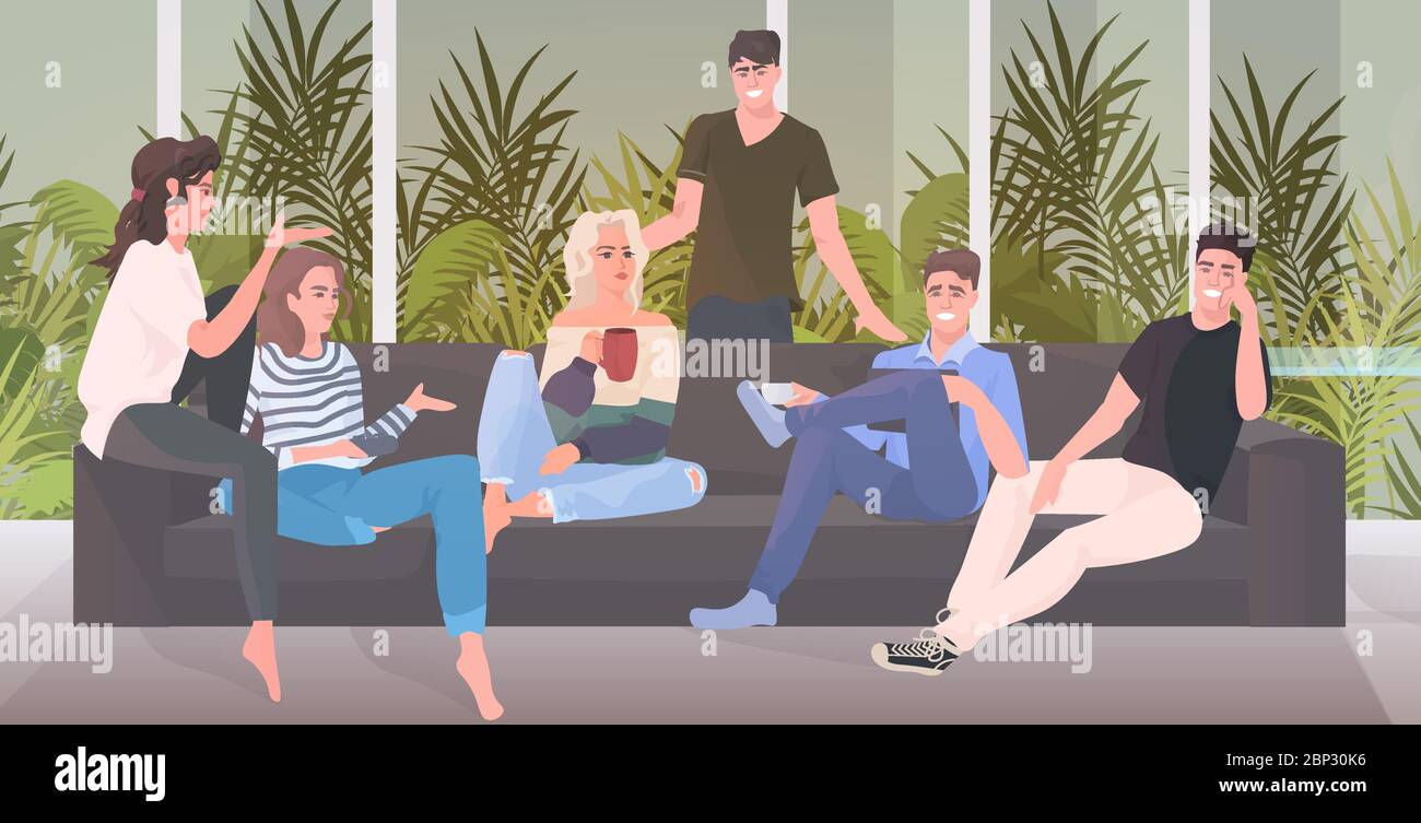 Group Of Happy Friends Spending Time Together Men Women Sitting On Sofa