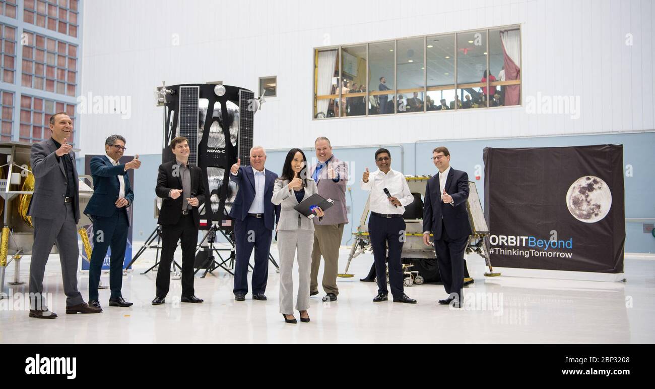 Commercial Lunar Payload Services Announcement From left to right, NASA Associate Administrator, Science Mission Directorate, Thomas Zurbuchen; Astrobotic Mission Director, Sharad Bhaskaran; Astrobotic CEO, John Thornton; Chairman of the Board of Intuitive Machines, Kam Ghaffarian; VP of Research and Development of Intuitive Machines, Tim Crain; President and CEO of OrbitBeyond, Siba Padhi; Chief Science Officer, OrbitBeyond, Jon Morse; and NASA Press Officer, Felicia Chou, front center, put their thumbs up at the conclusion of an event announcing the companies that will provide the first lu Stock Photo
